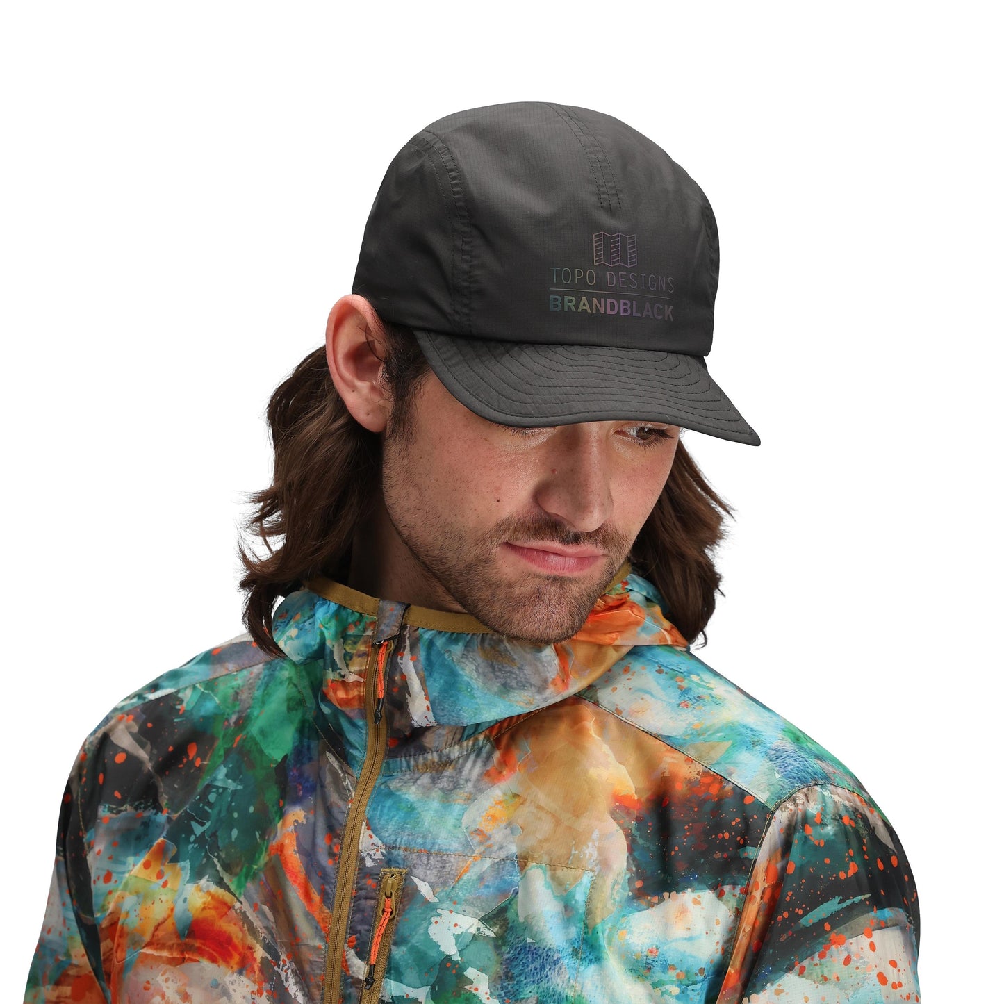 Model shot of Topo Designs x Brand Black Global Pack Cap in "Black"
