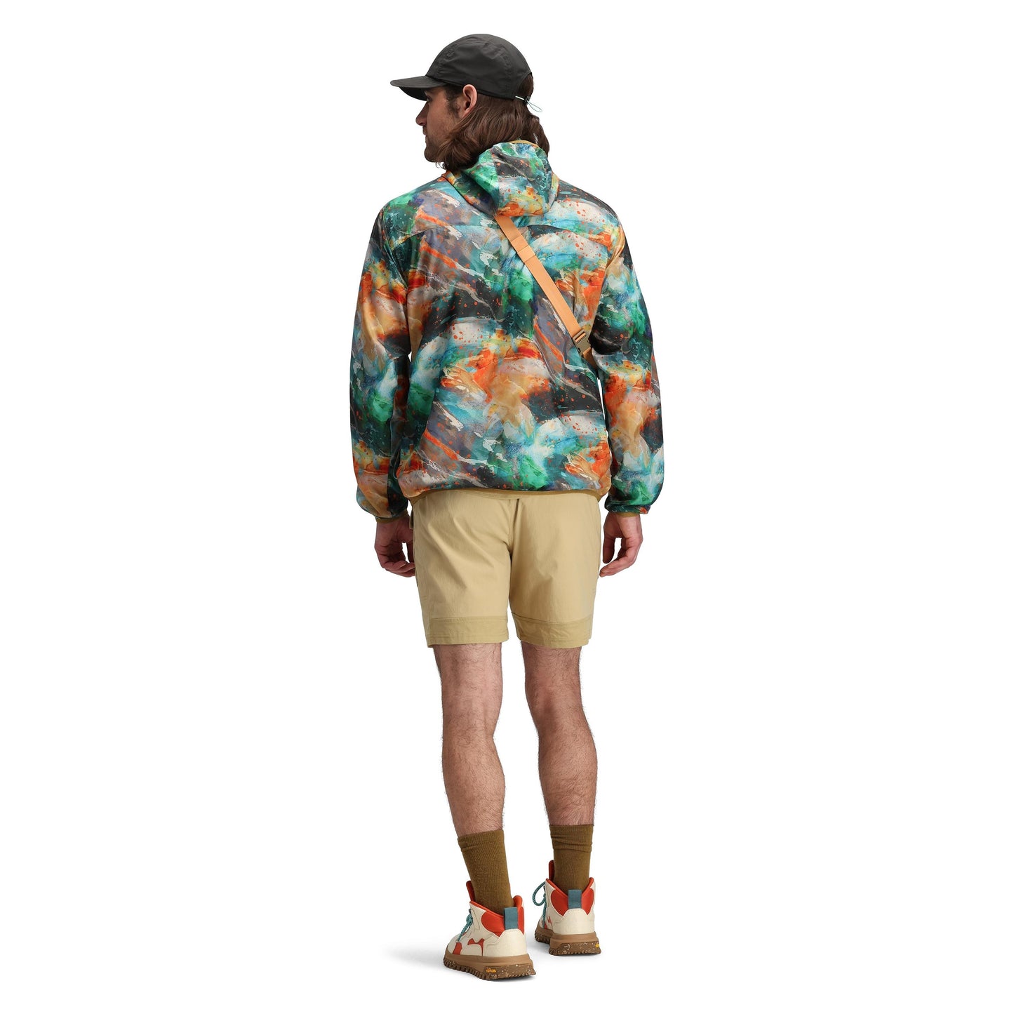 Model shot of Topo Designs x Brand Black Global Ultralight Packable Jacket in "Koi"