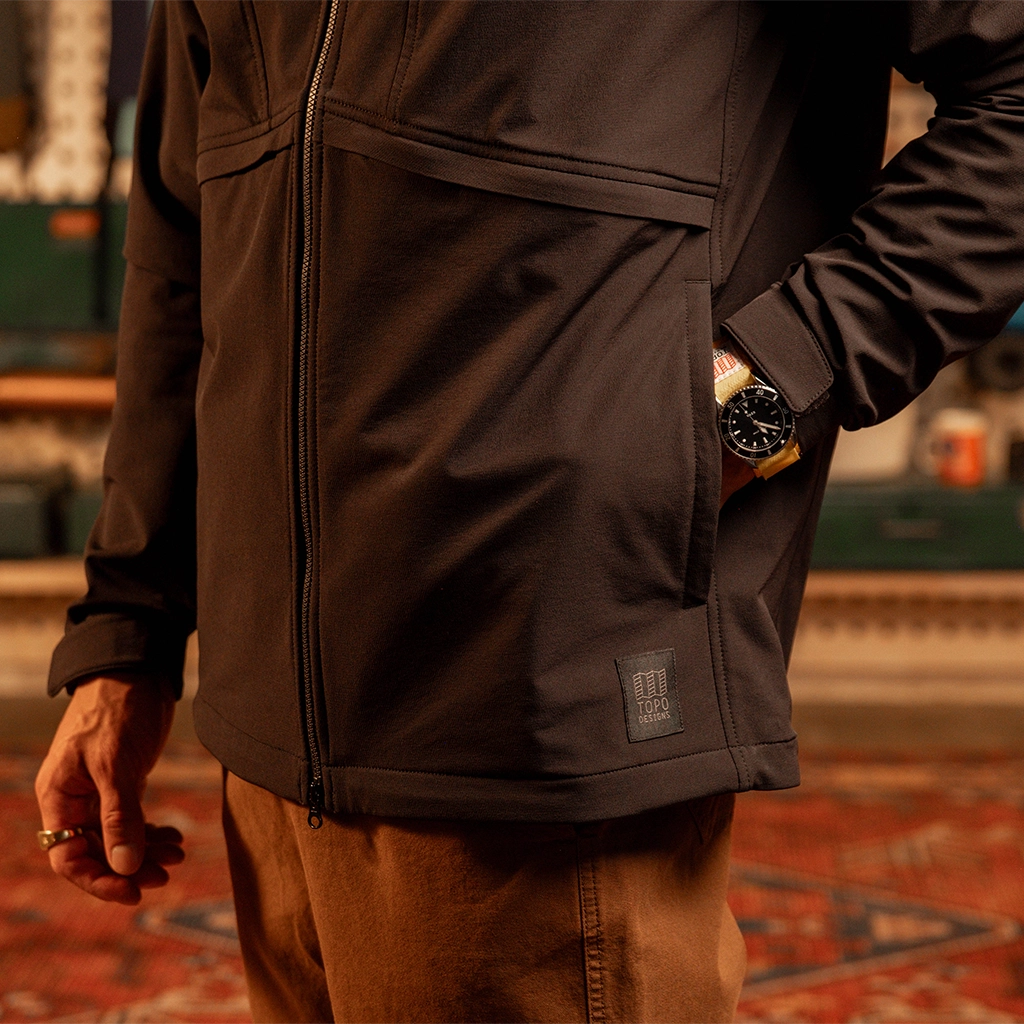 General close up view of model wearing HighPeak Jacket in 'Black' with hand in pocket.