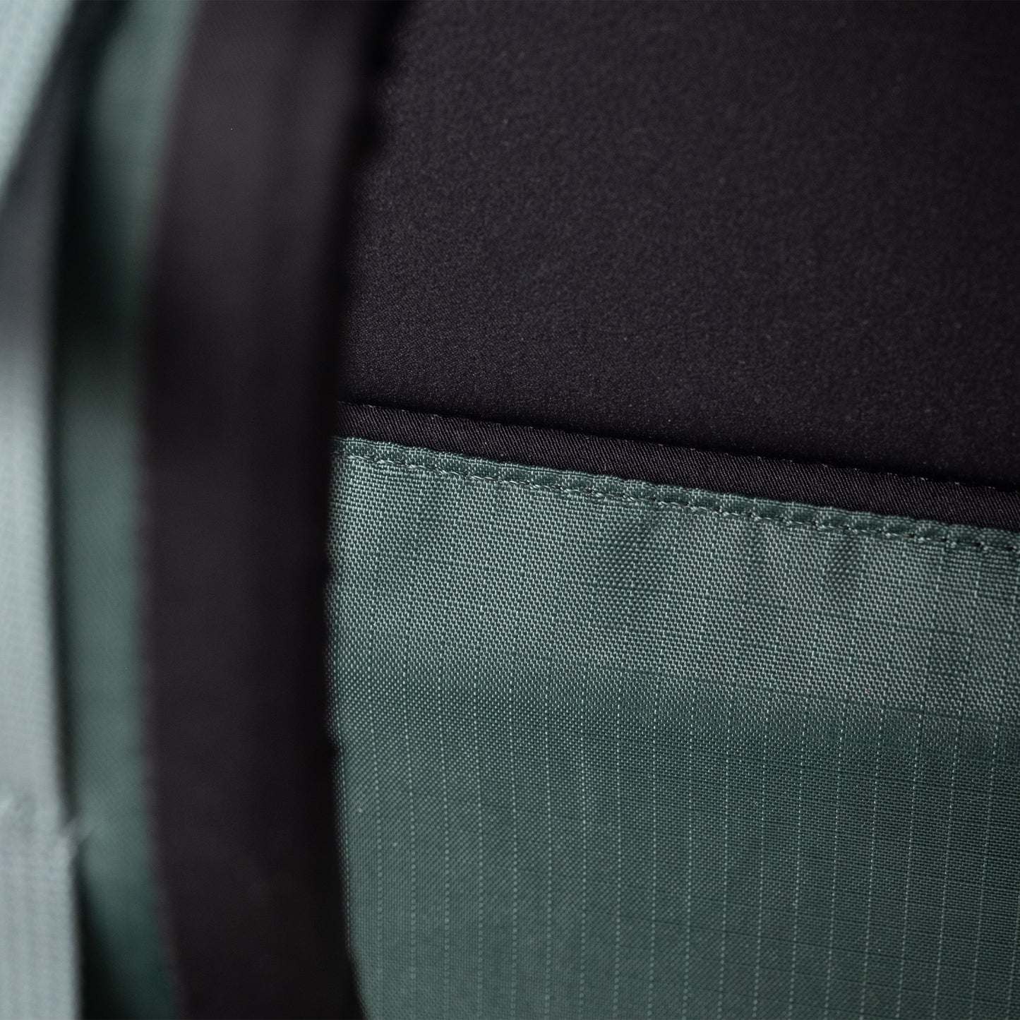 General Detail shot of Topo Designs Global Travel Backpack in "Stone Blue / Forest"