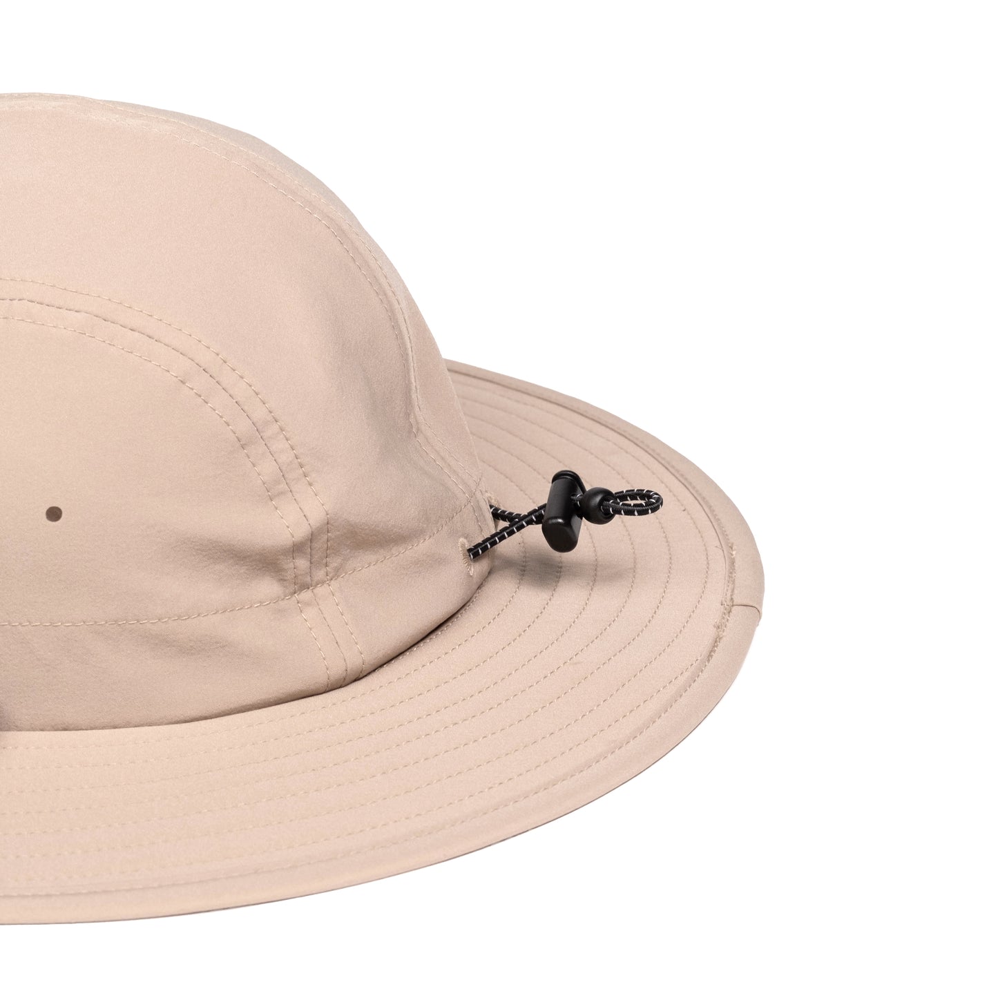 General detail shot of Topo Designs Sun Hat with original logo patch in "Cobblestone".