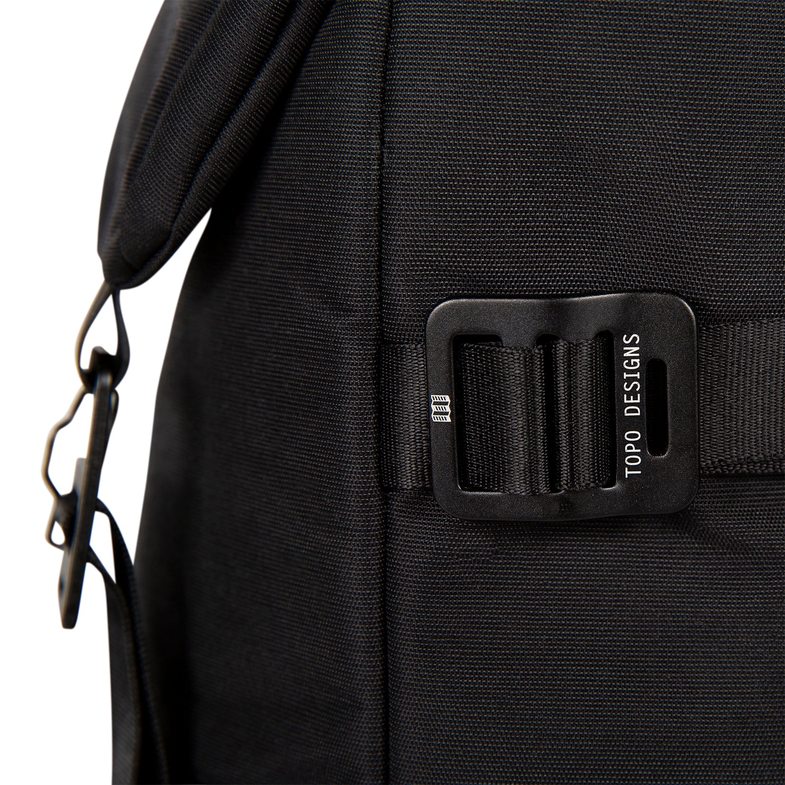 Detail Shot of the Topo Designs Rover Pack Premium showing the hardware on the side of the bag in "Premium Black".