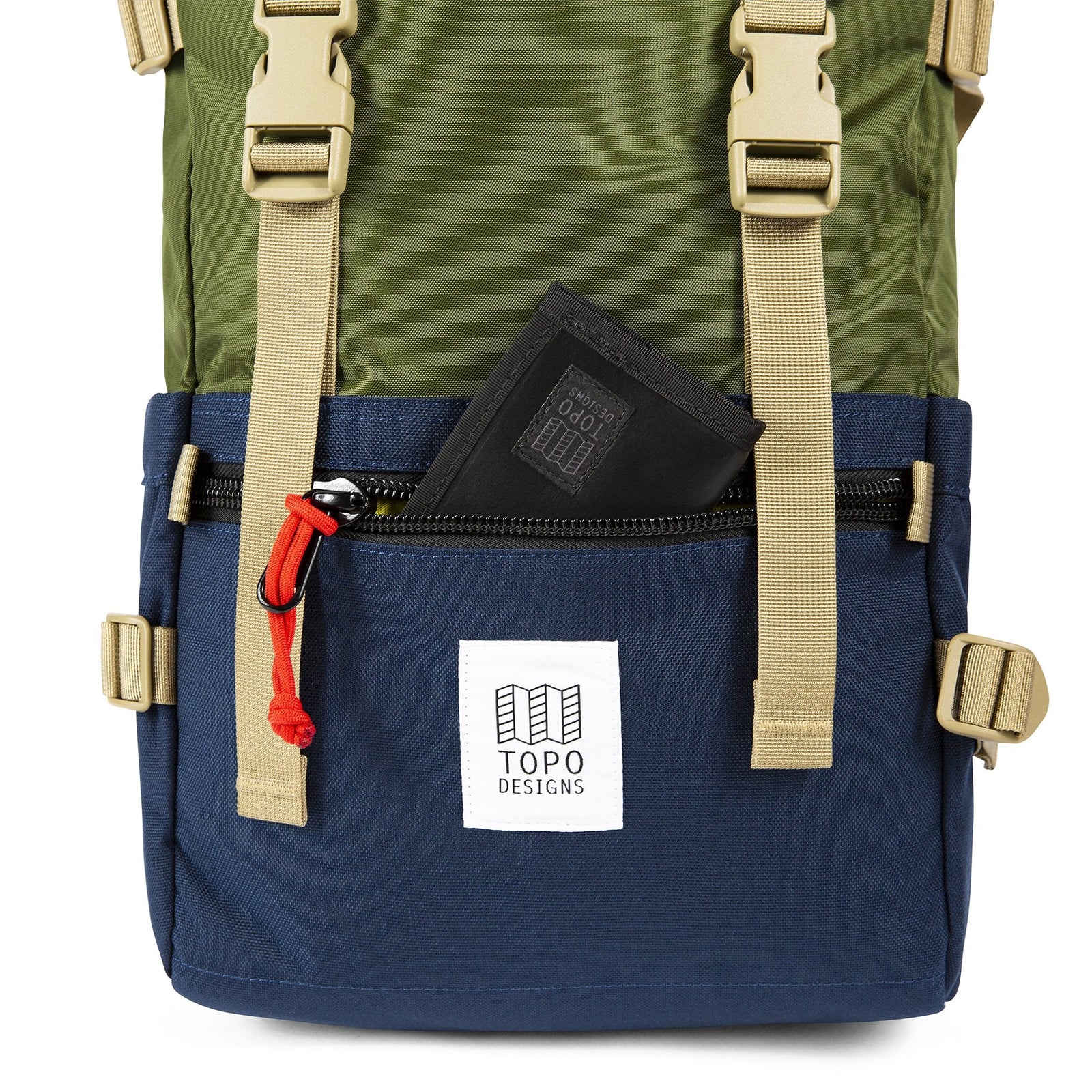 General front detail shot of the Topo Designs Rover Pack Classic in Olive/Navy showing front zipper pocket.