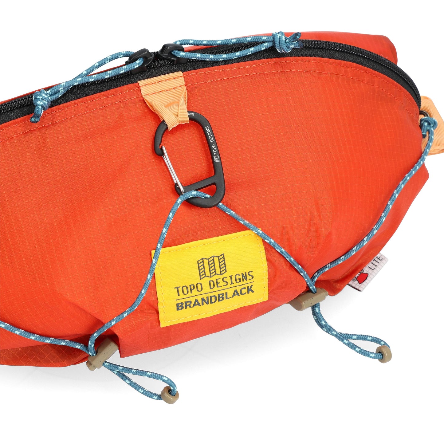 Detail shot of Topo Designs x Brand Black Topolite Hip Pack in "Koi"