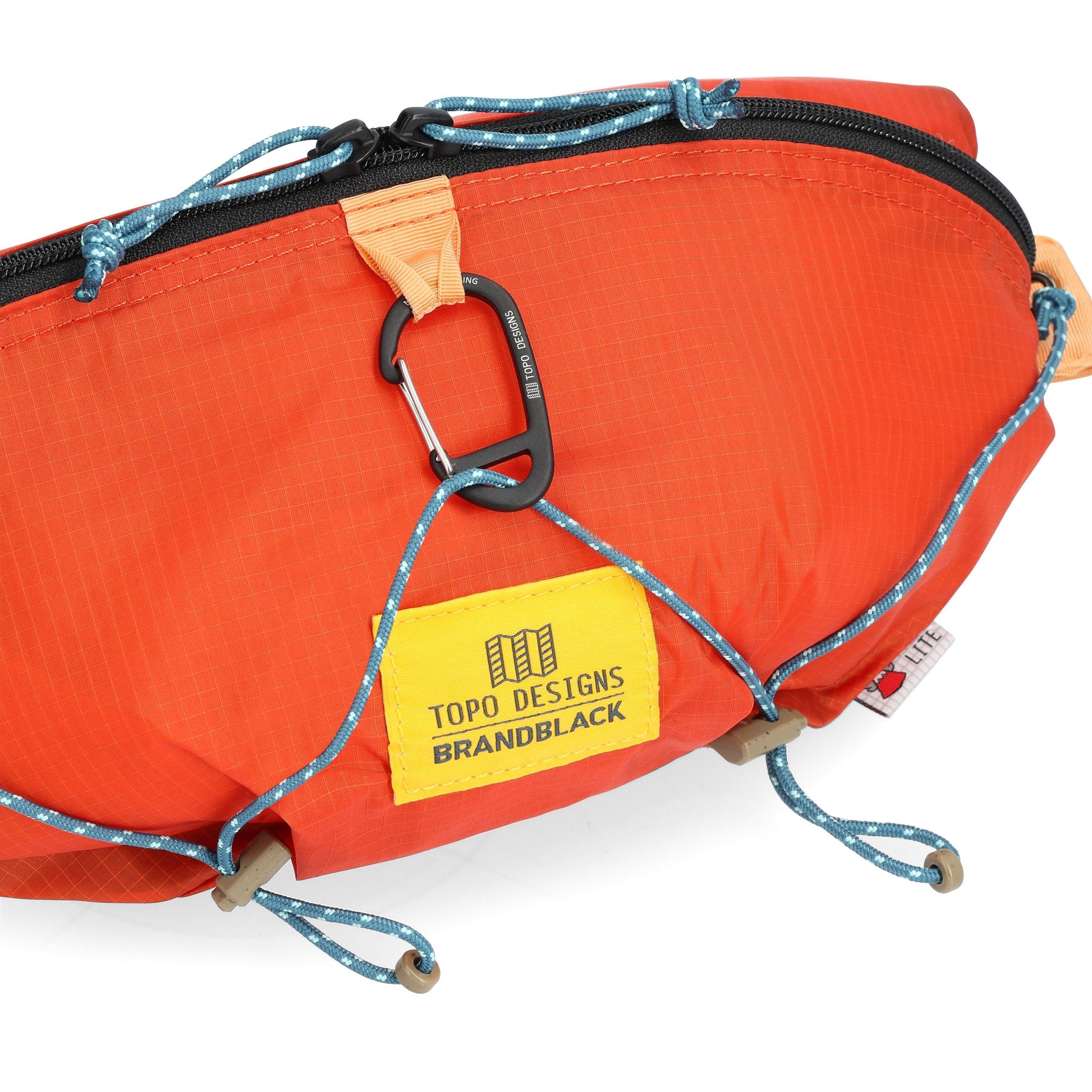 Detail shot of Topo Designs x Brand Black Topolite Hip Pack in "Koi"