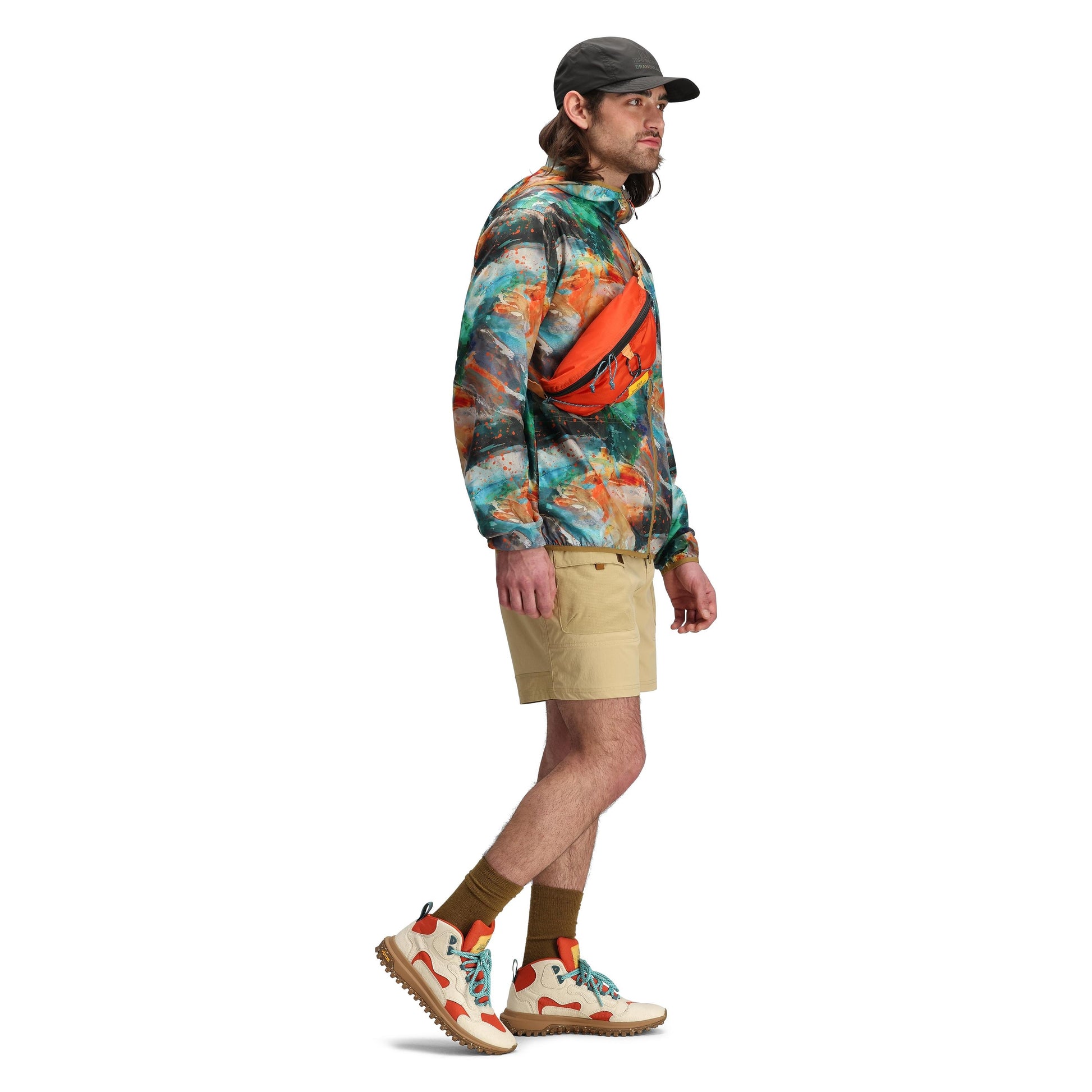 Model shot of Topo Designs x Brand Black Global Ultralight Packable Jacket in "Koi"