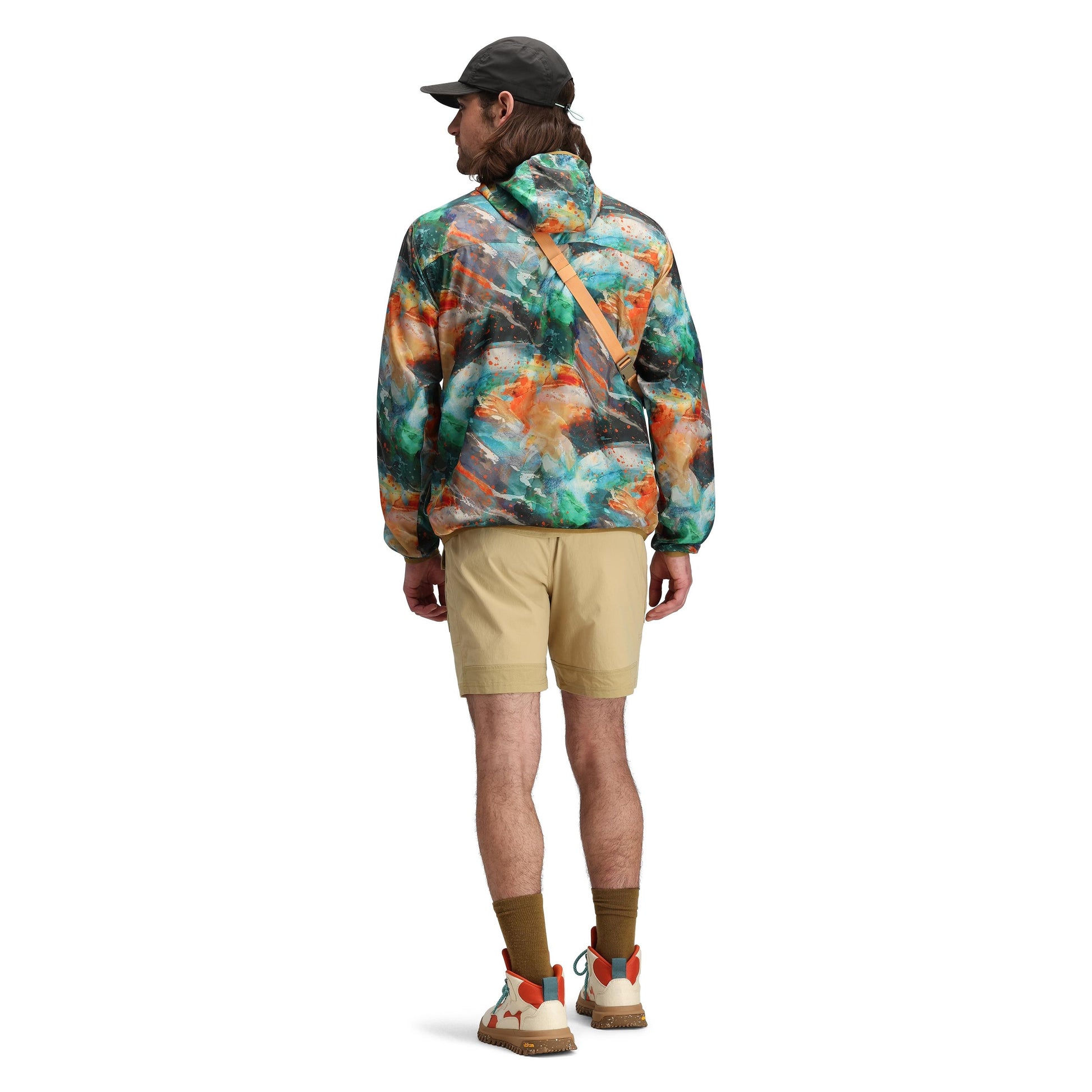 Model shot of Topo Designs x Brand Black Global Ultralight Packable Jacket in "Koi"