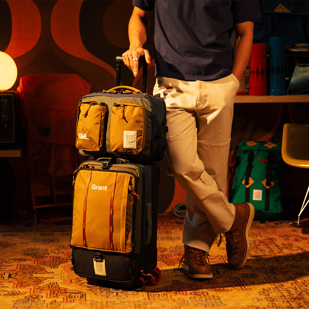 General model shot of Global Travel Bag Roller Bag in "Olive / Dark Khaki"