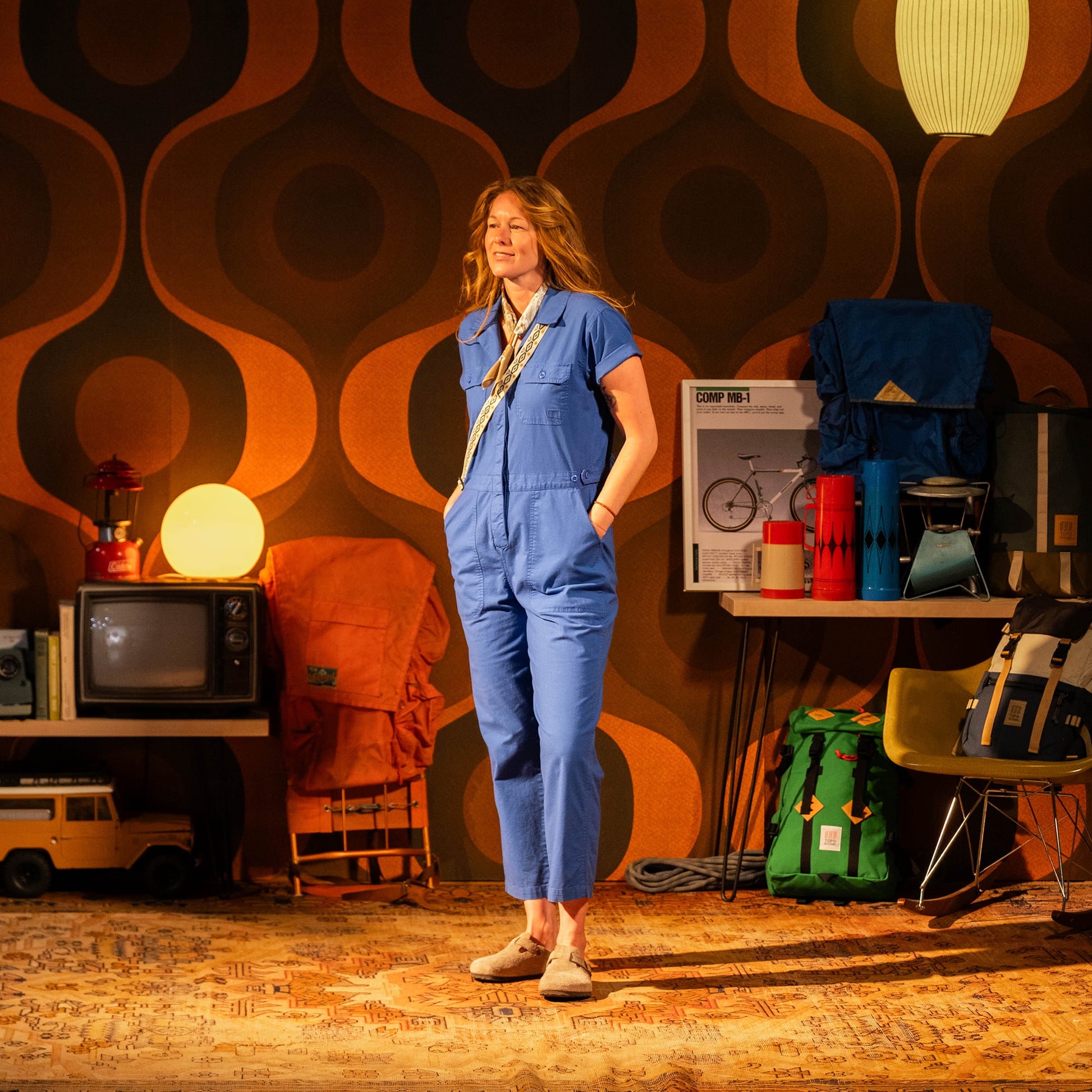 General in studio model image of female wearing Topo Designs Desert Coverall in "French Blue"