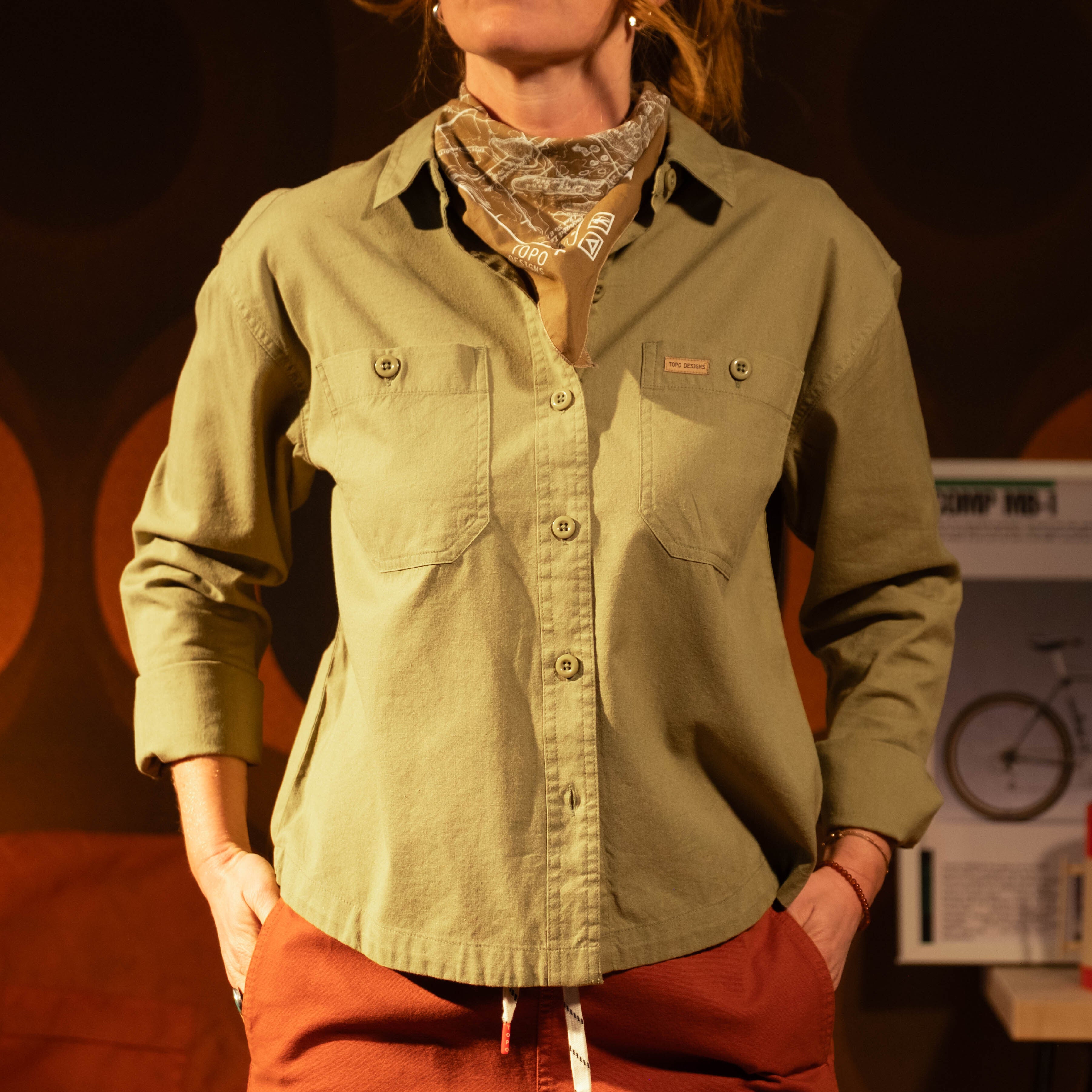 General image of female model in studio wearing Topo Designs Daytripper Shirt Long Sleeve - Women's [Model is 5'10", wearing size medium]
