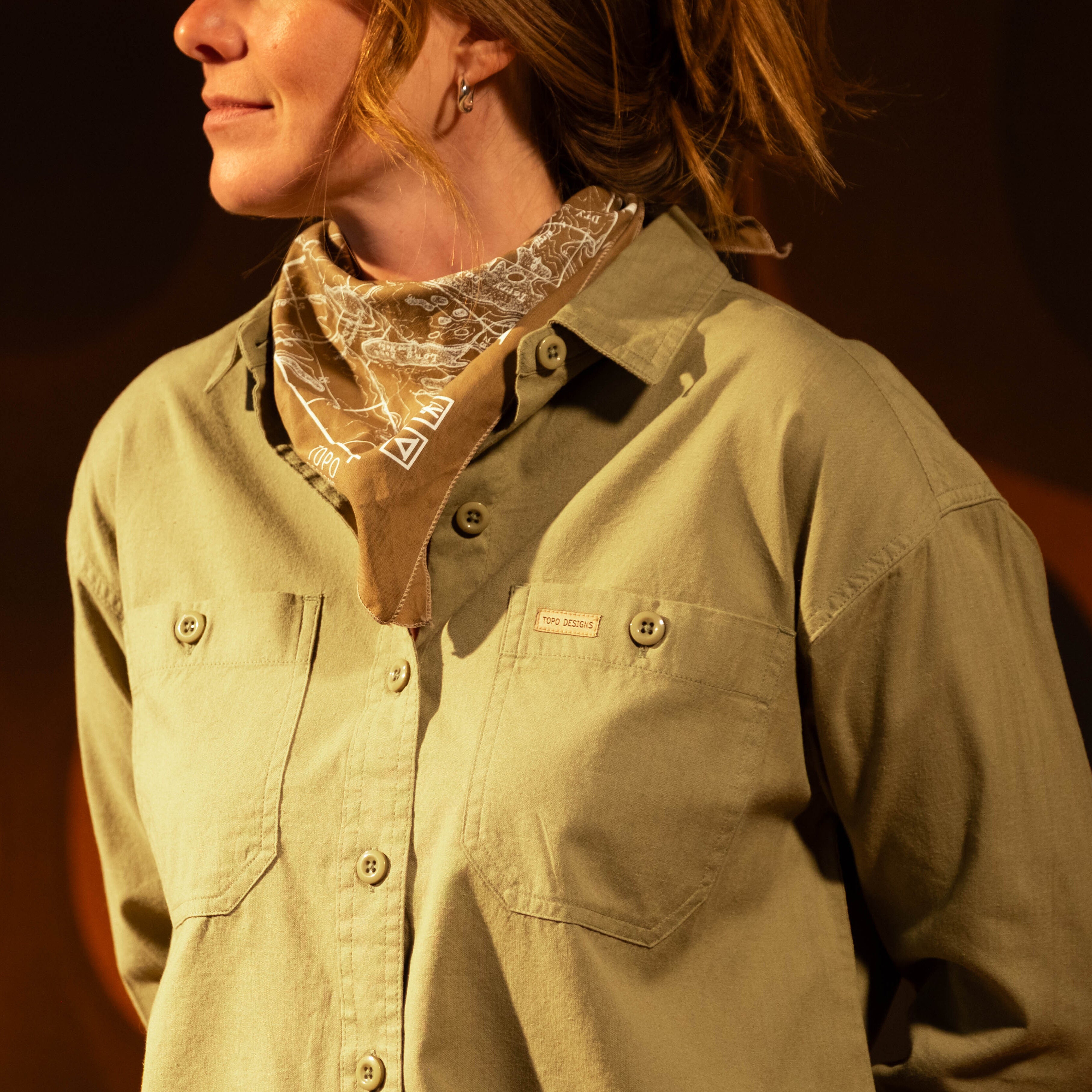 General image of female model in studio wearing Topo Designs Daytripper Shirt Long Sleeve - Women's [Model is 5'10", wearing size medium]