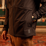 General close up view of model wearing HighPeak Jacket in 'Black' with hand in pocket. [Model is 5'11', wearing size medium]