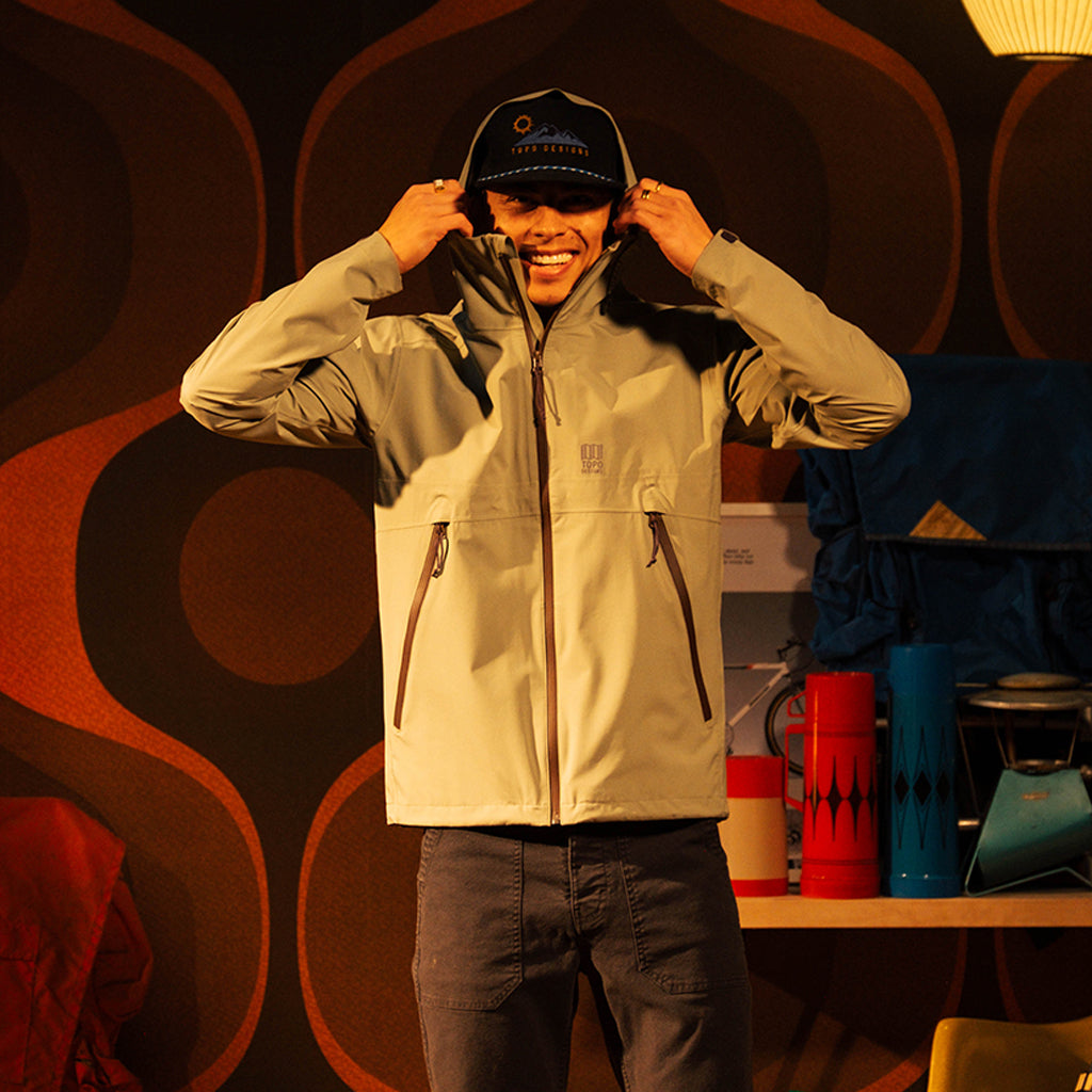 General front image of a man wearing a global jacket in "Oil Green"