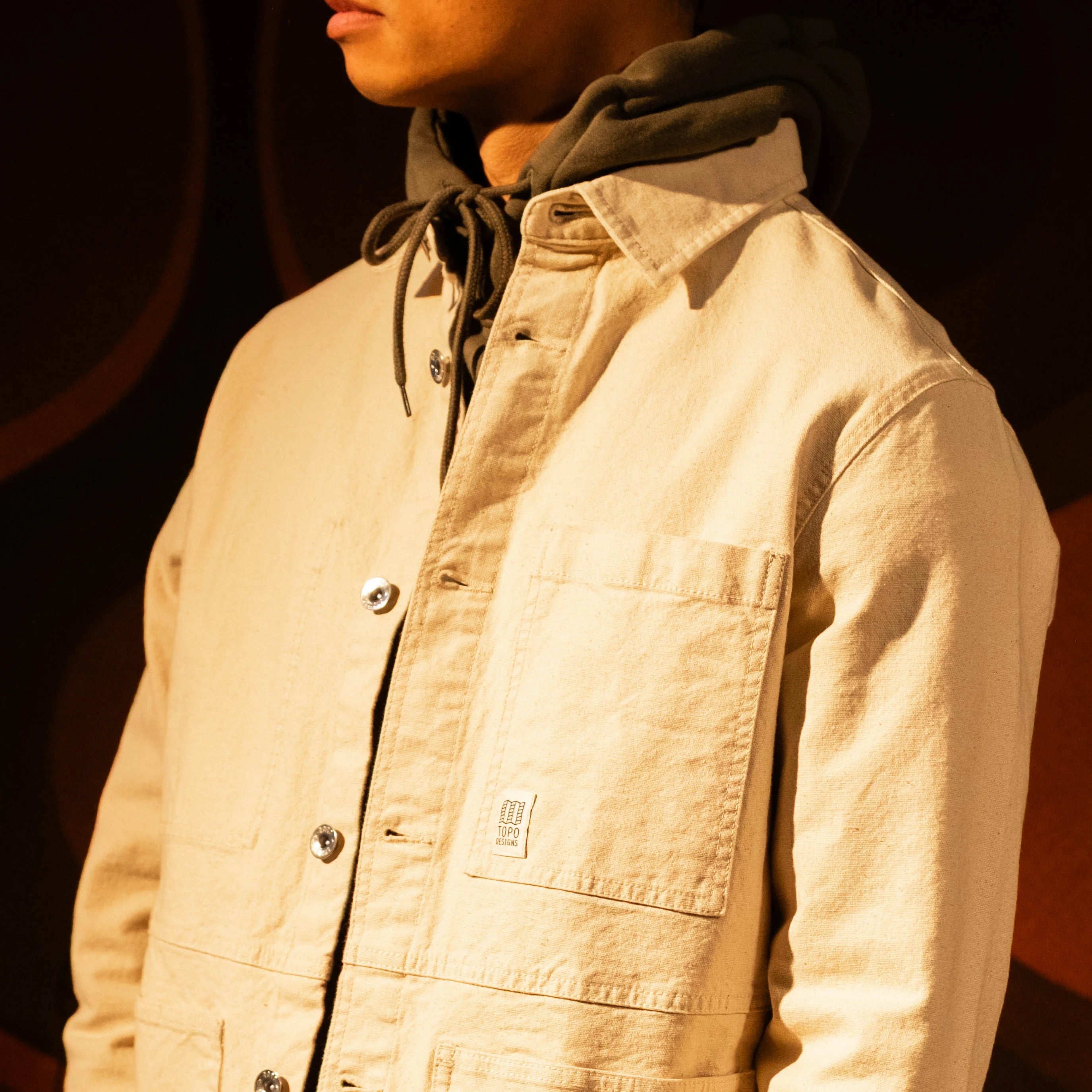 General model shot of Front view of Topo Designs Utility Jacket Undyed - Men's in "Undyed" [Model is 5'11', wearing size medium]