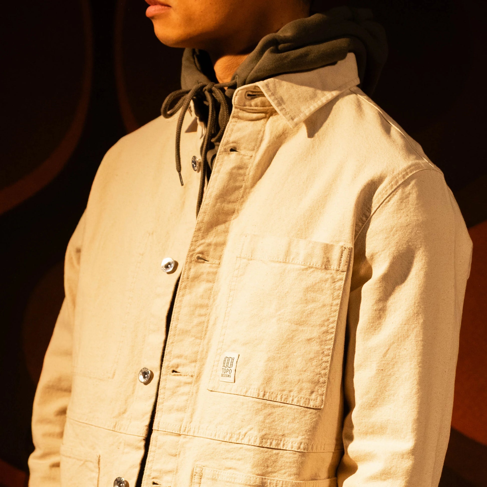 Model shot of Front view of Topo Designs Utility Jacket Undyed - Men's in "Undyed"