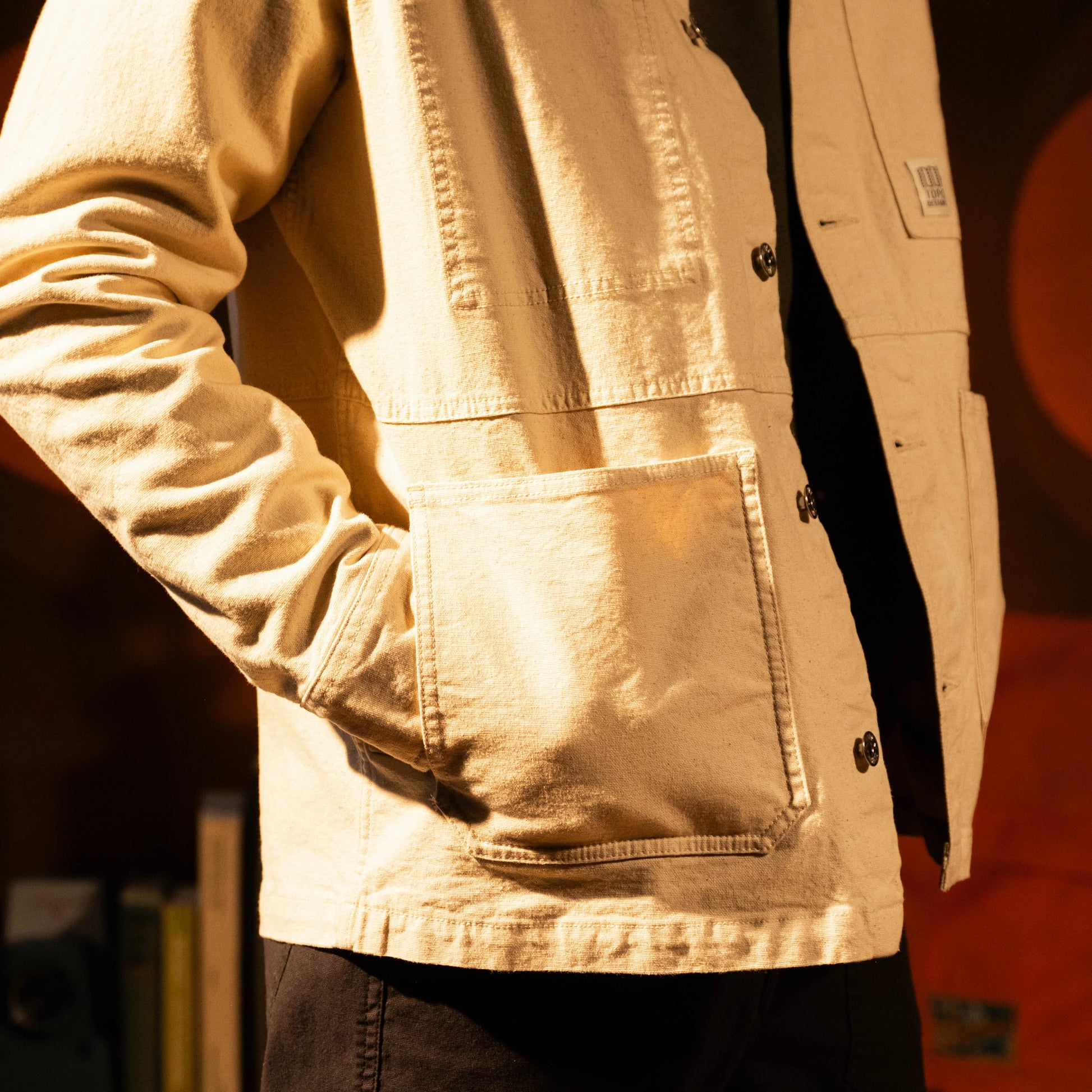 Model shot of Front view of Topo Designs Utility Jacket Undyed - Men's in "Undyed"