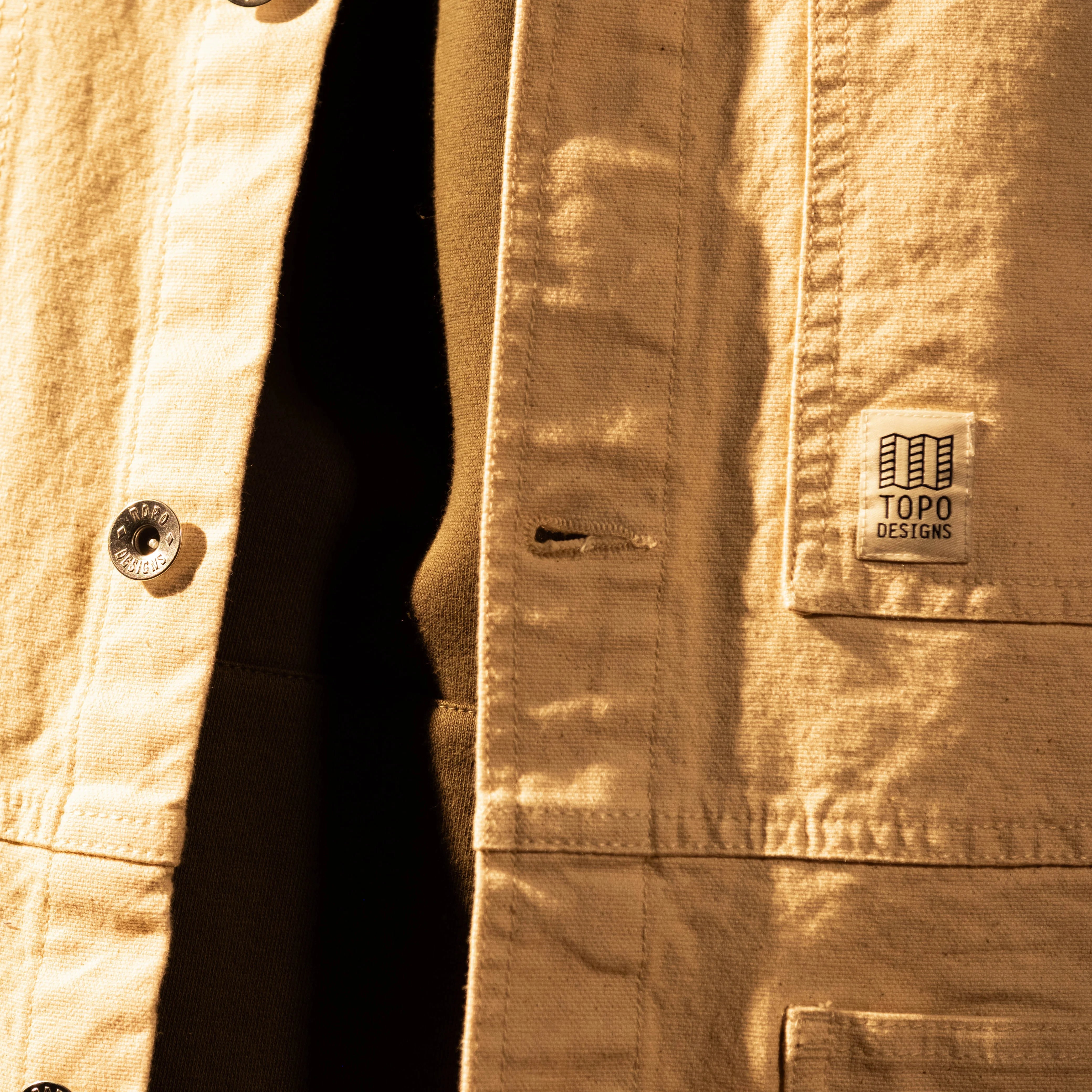 General model shot of Front view of Topo Designs Utility Jacket Undyed - Men's in "Undyed" [Model is 5'11', wearing size medium]