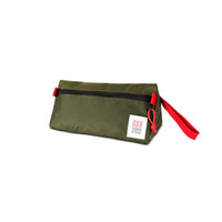 3/4 front product shot of Topo Designs Dopp Kit in "Olive" green.