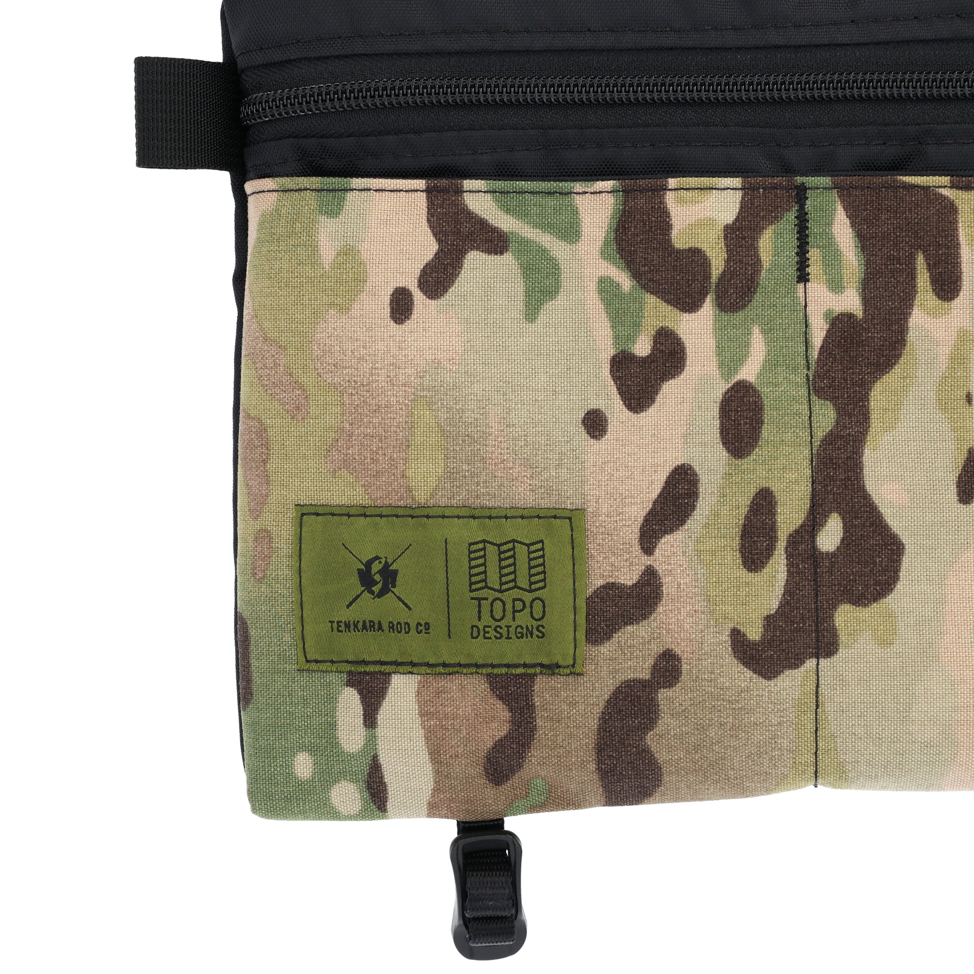 Detail shot of Topo Designs X Tenkara Rod Co Kit Shoulder Accessory Bag logo in "Sierra".