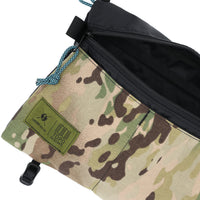Detail shot of Topo Designs X Tenkara Rod Co Kit Shoulder Accessory Bag logo in "Sierra".