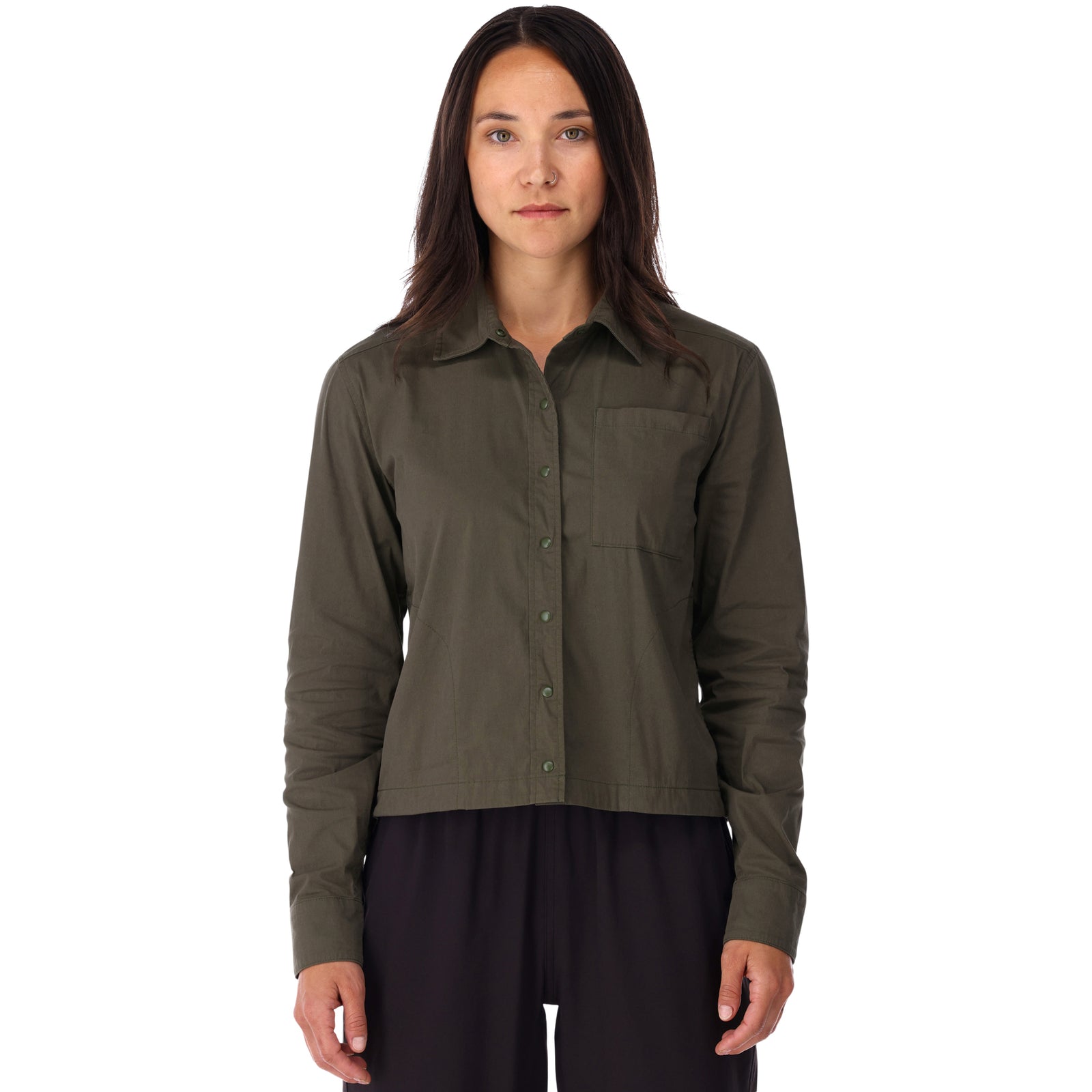 Front model shot of Topo Designs Women's Global long sleeve lightweight snap travel shirt in "olive" green on model front.