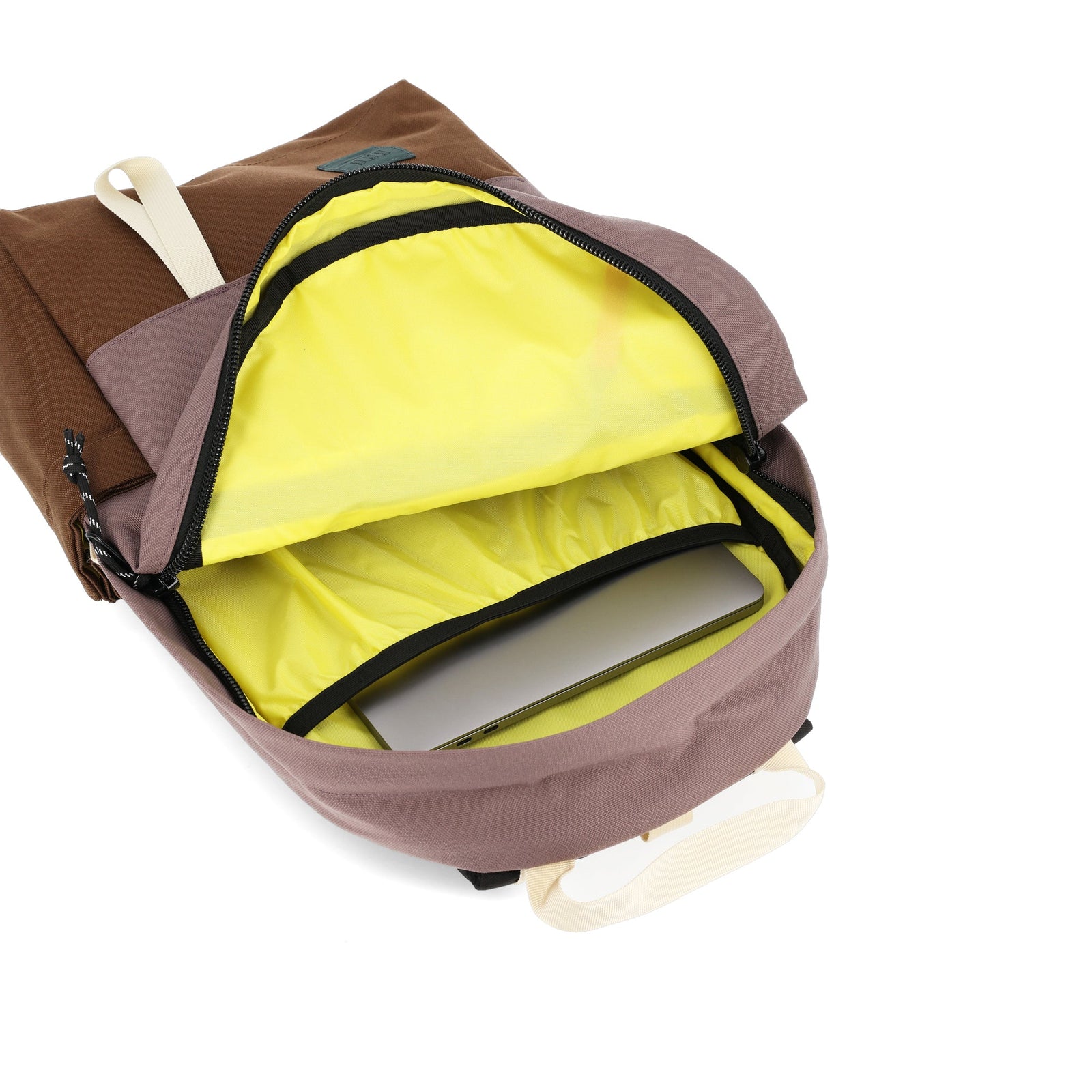 General detail of yellow interior and laptop sleeve on Topo Designs Daypack Classic 100% recycled nylon laptop backpack for work or school in "Peppercorn / Cocoa" purple brown