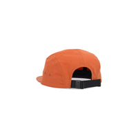 Back of Topo Designs Nylon Camp 5-panel flat brim Hat in "Brick" orange.