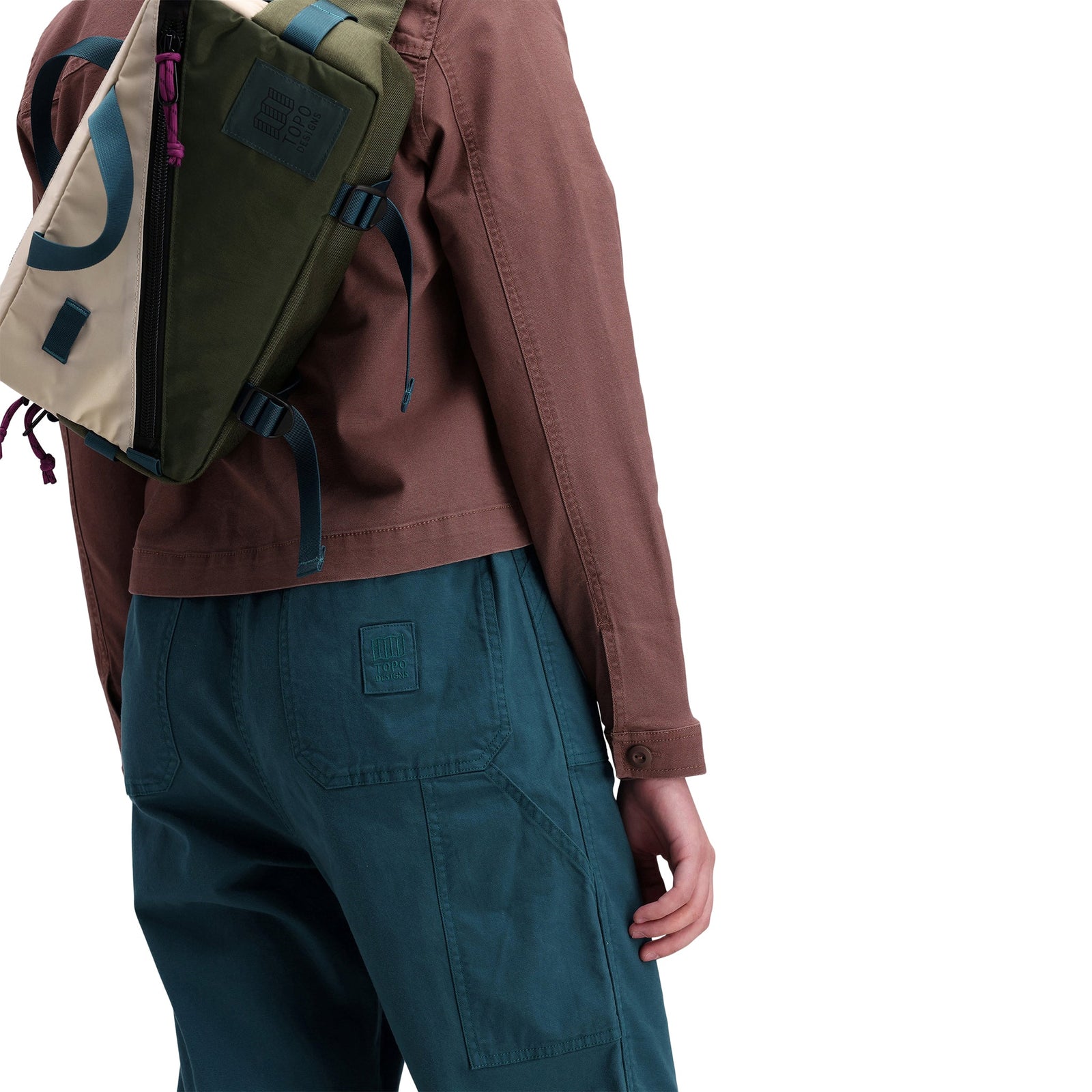 Back model shot of Topo Designs Women's Dirt Jacket 100% organic cotton shirt jacket in "peppercorn" brown purple