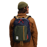 Close up model shot of Topo Designs Session Pack laptop backpack in "Olive / Navy"
