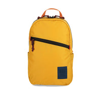 Front view of Topo Designs Light Pack in recycled "Mustard" nylon.
