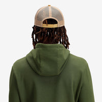 General shot Topo Designs Trucker Hat with mesh back and original logo patch in "Khaki".