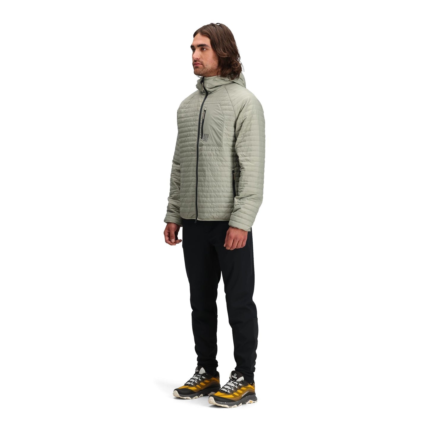 General side model shot of Topo Designs Global Puffer Hoodie - Men's in "Dried Sage"