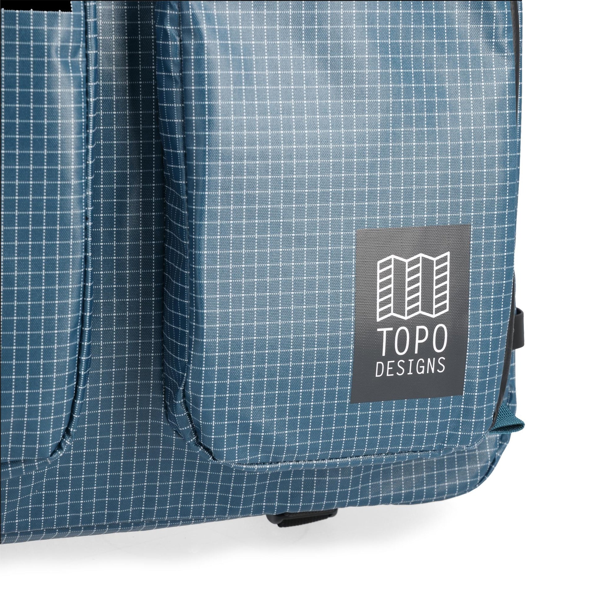 General detail shot of Topo Designs Apex Briefcase in "Pond Blue Grid"