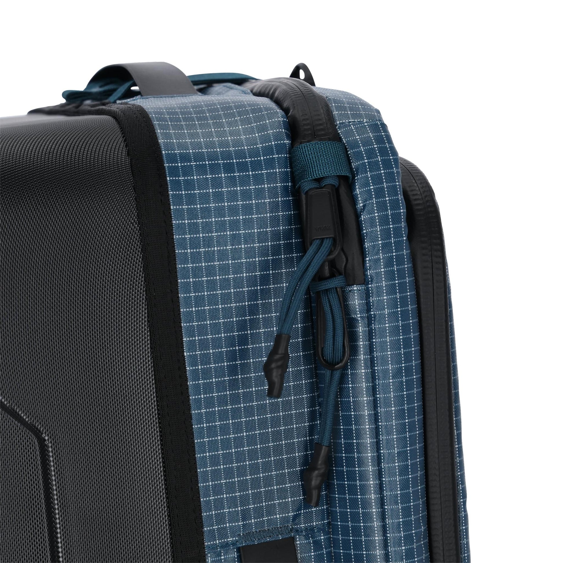 General detail shot of Topo Designs Apex Travel Roller Bag in "Pond Blue Grid"