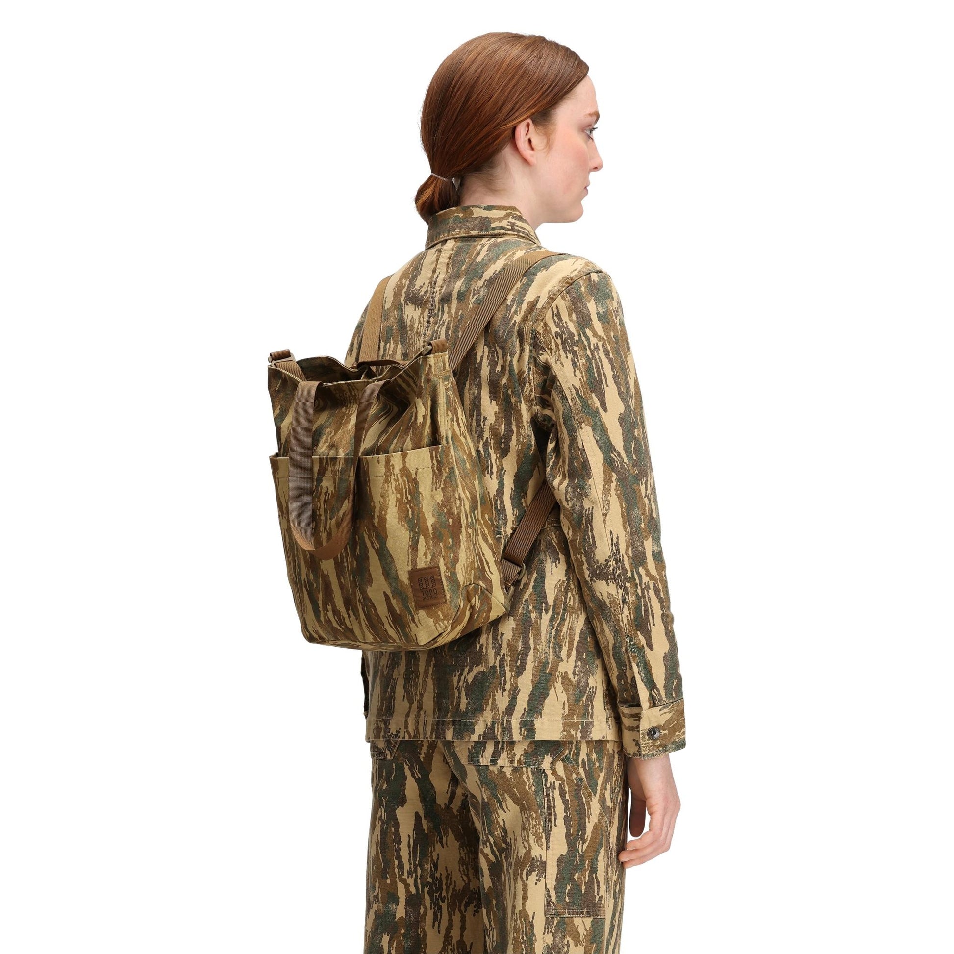 General back model shot of Topo Designs Dirt Tote Bag in "Dirt Camo Print"