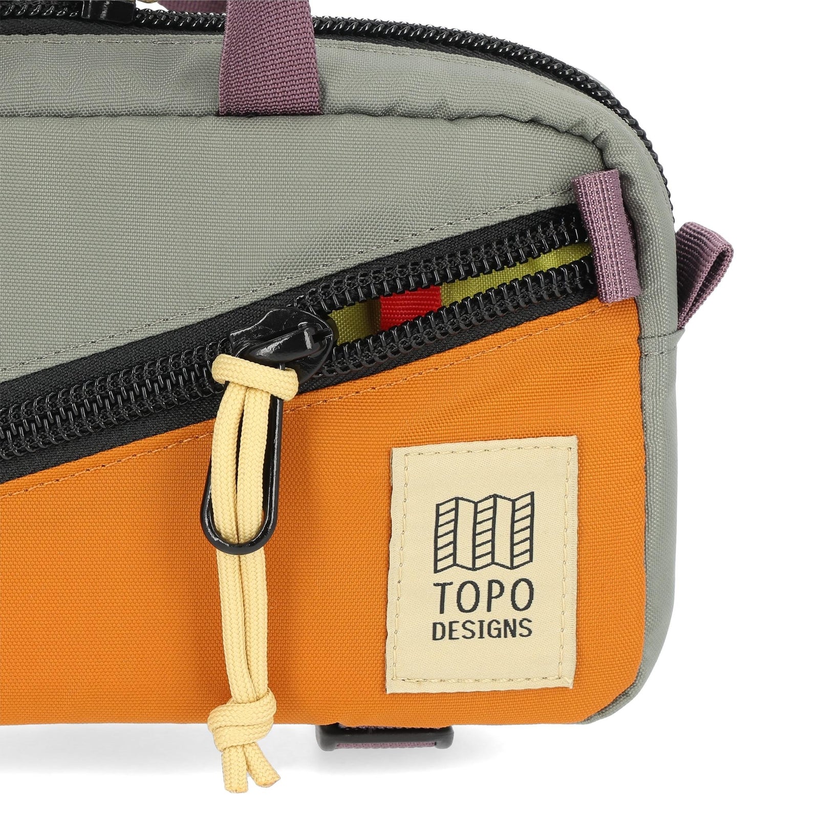 Detail shot of Topo Designs Mini Quick Pack in "Beetle / Spice"