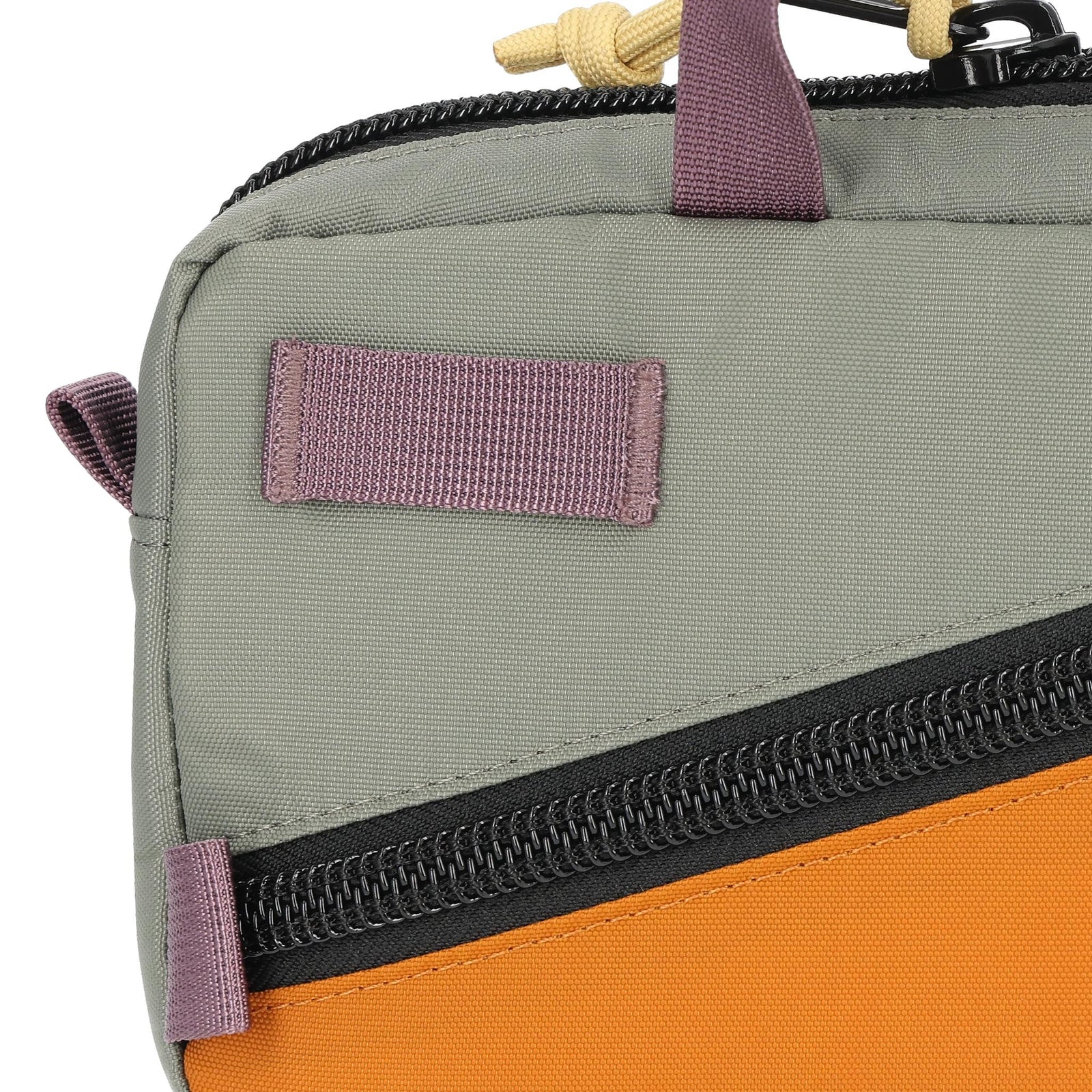 Detail shot of Topo Designs Mini Quick Pack in "Beetle / Spice"