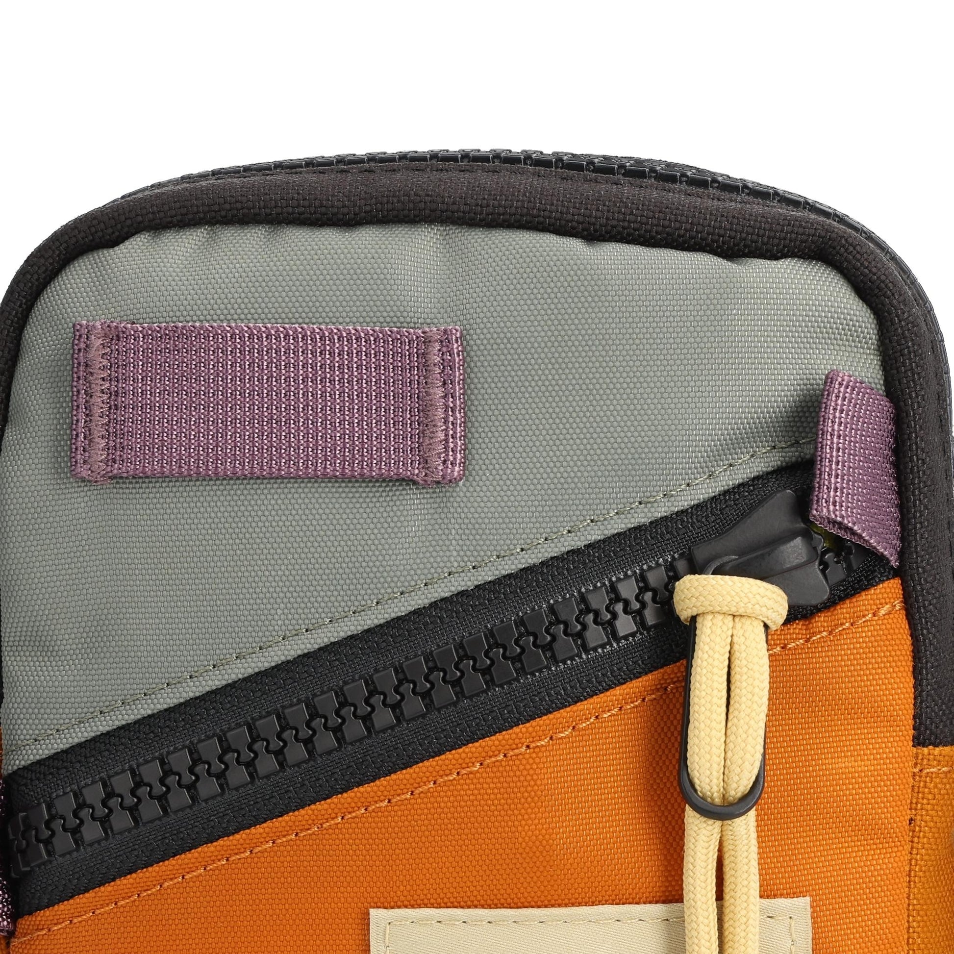 Detail shot of Topo Designs Mini Shoulder Bag in "Beetle / Spice"