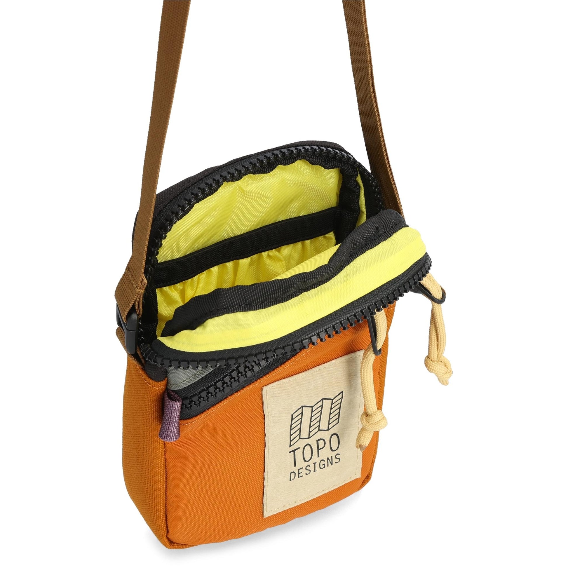 Detail shot of Topo Designs Mini Shoulder Bag in "Beetle / Spice"