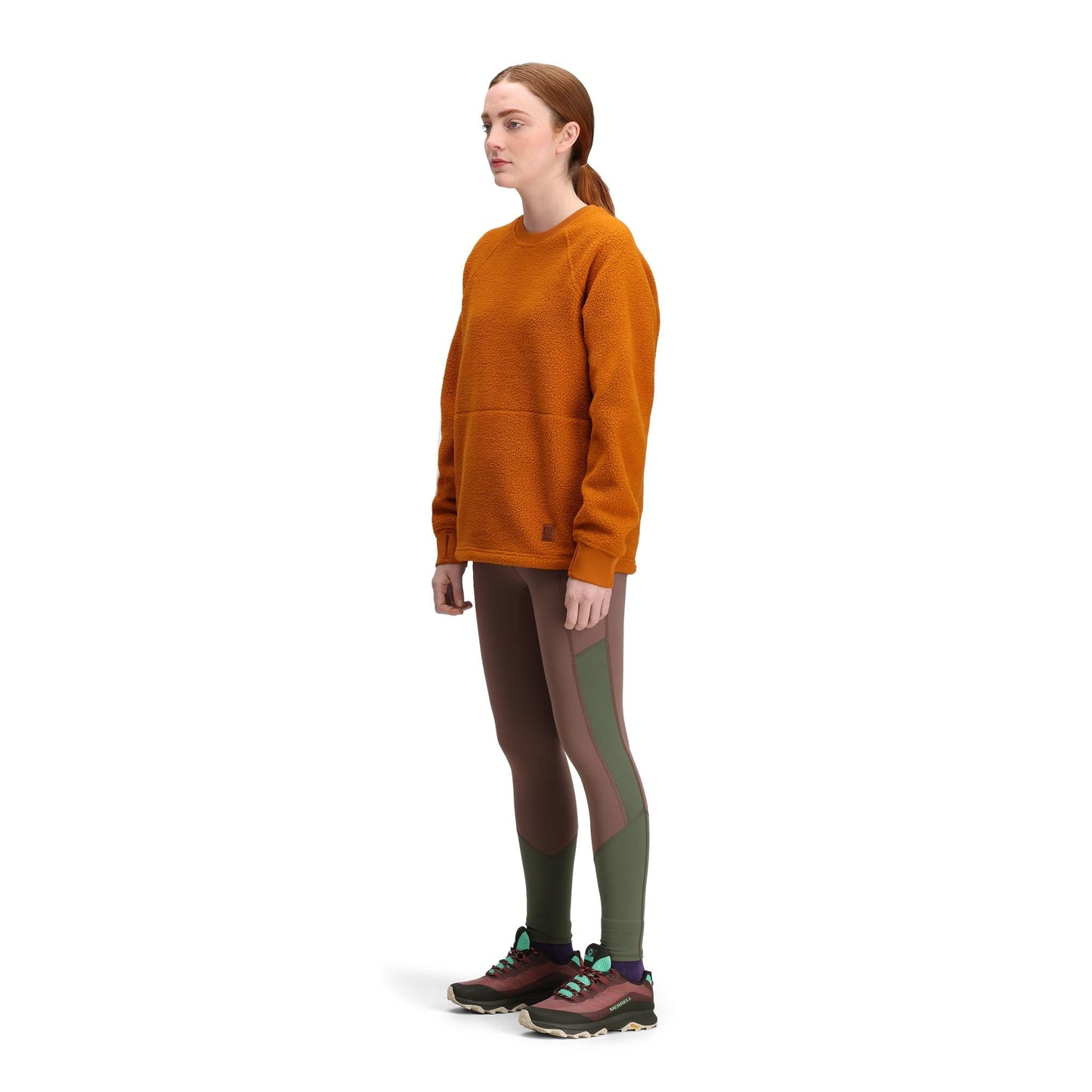 General side model shot of Topo Designs Mountain Fleece Crew in "Spice"