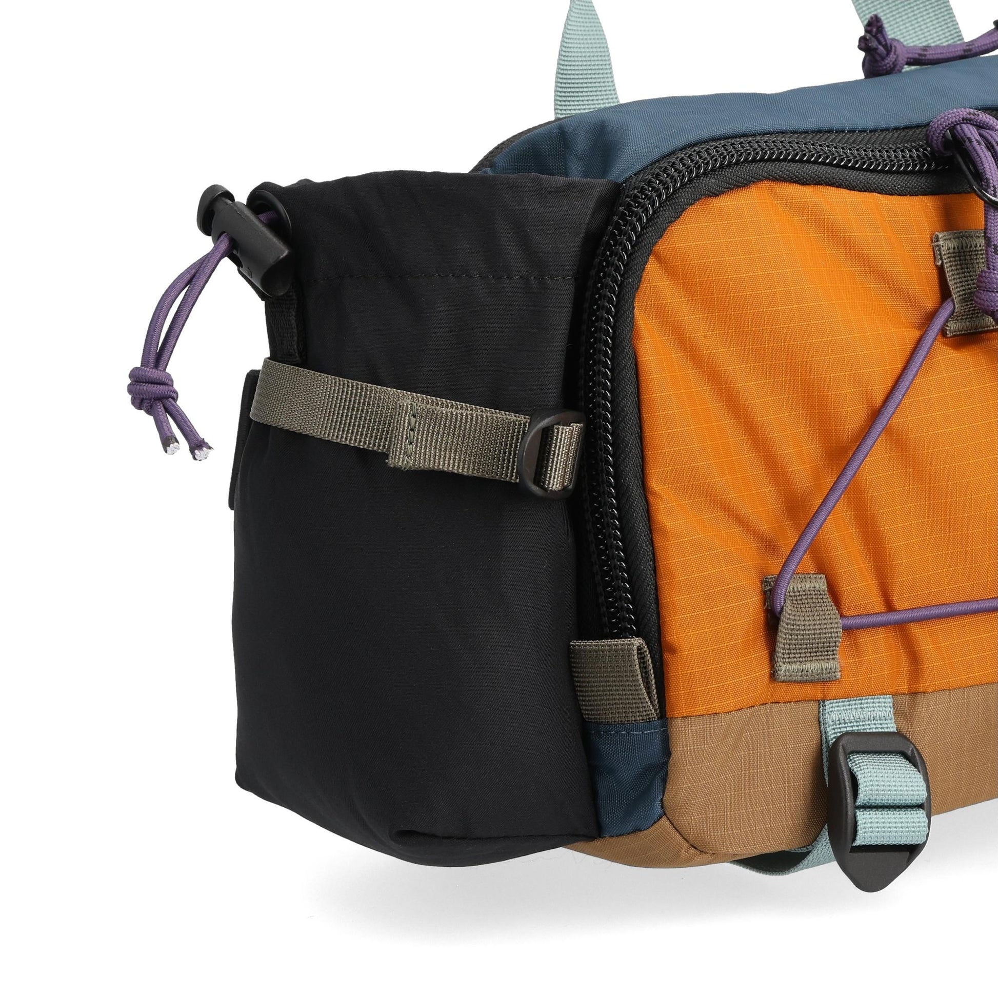 Detail shot of Topo Designs Mountain Hydro Hip Pack in "Pond Blue / Spice"