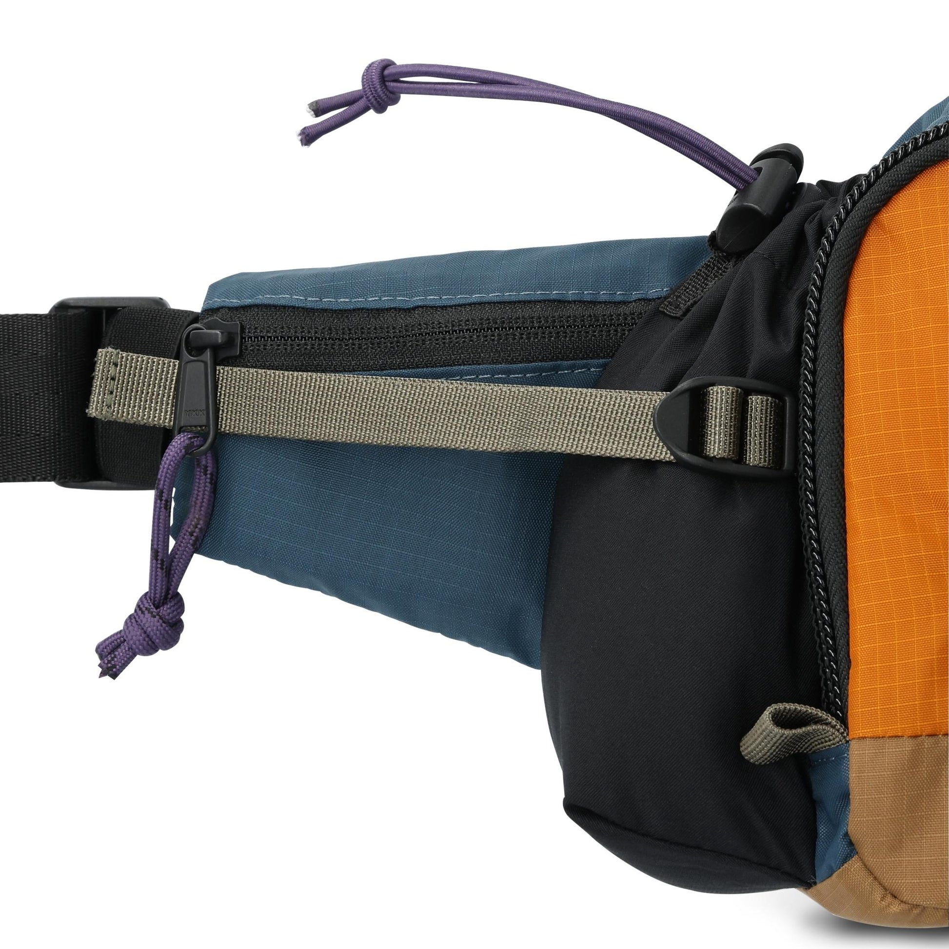 Detail shot of Topo Designs Mountain Hydro Hip Pack in "Pond Blue / Spice"