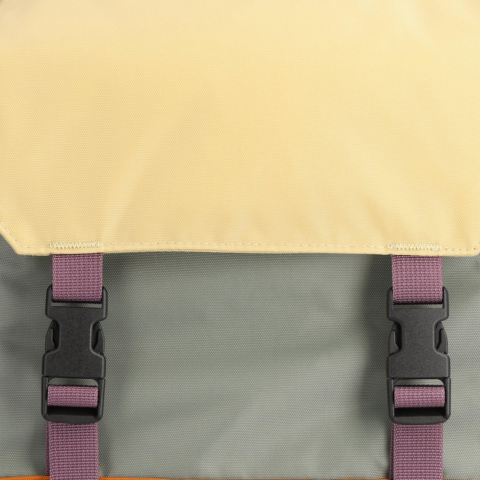 Detail shot of Topo Designs Rover Pack Mini in "Beetle / Spice"