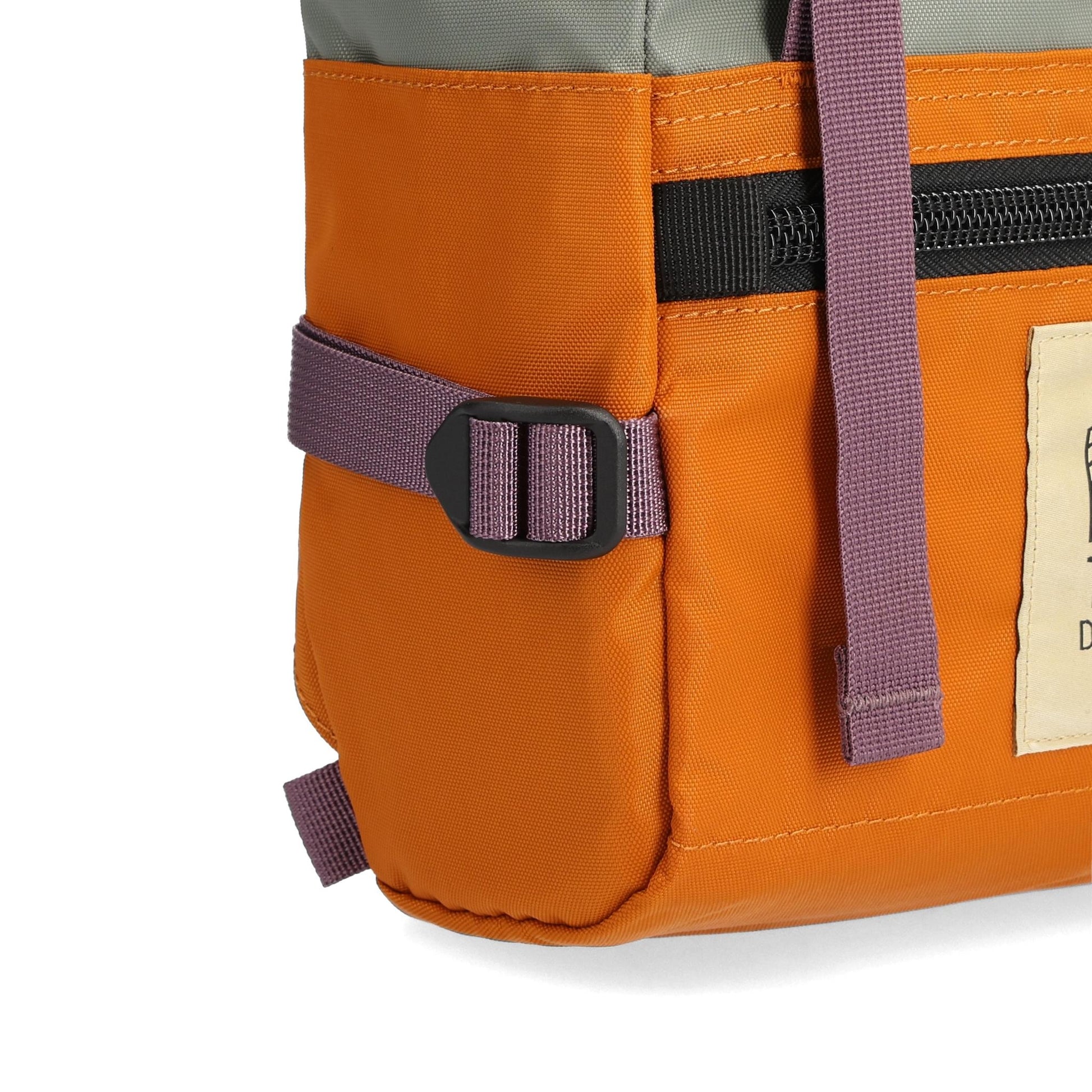 Detail shot of Topo Designs Rover Pack Mini in "Beetle / Spice"