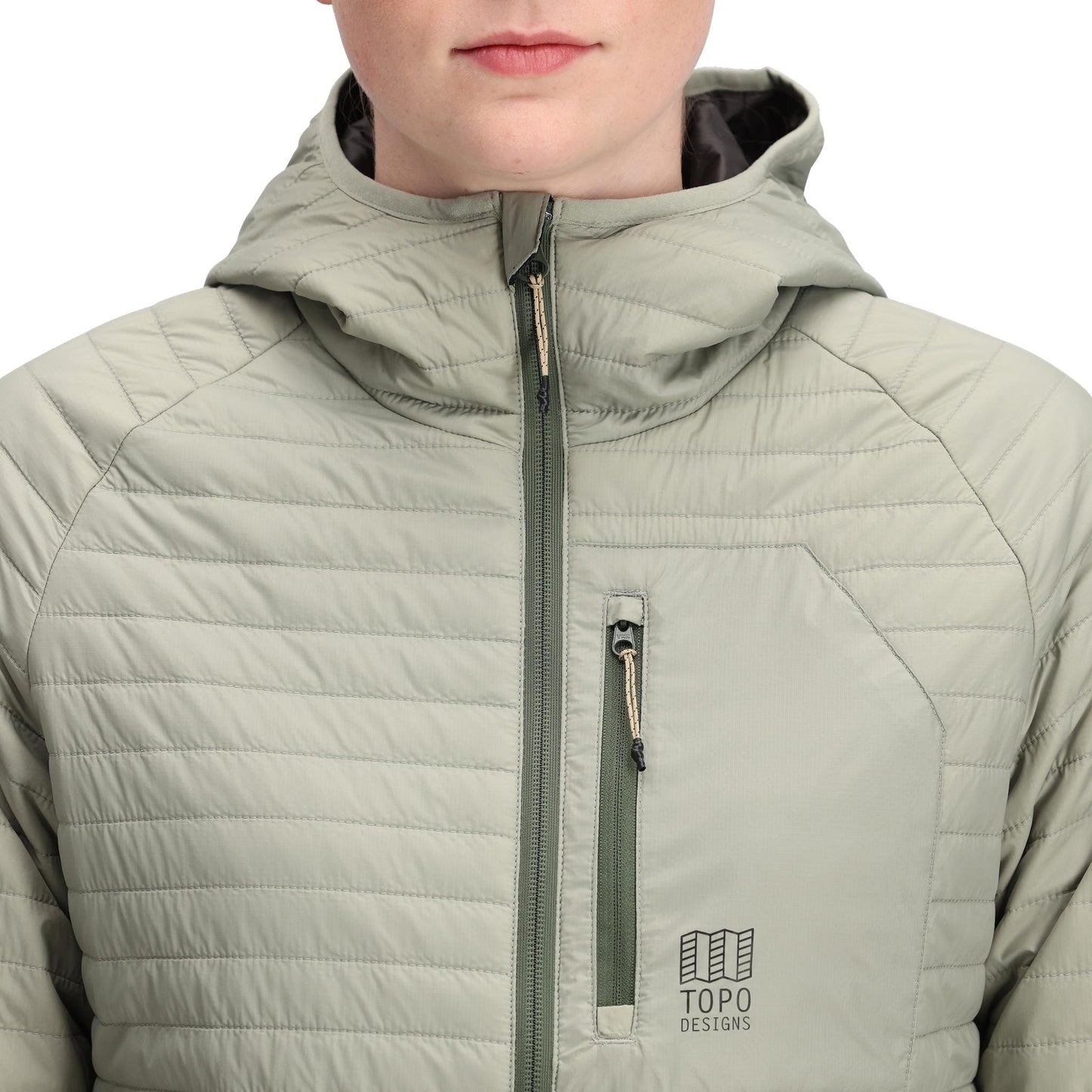 Detail shot of Topo Designs Global Puffer Hoodie - Women's in "Dried Sage"