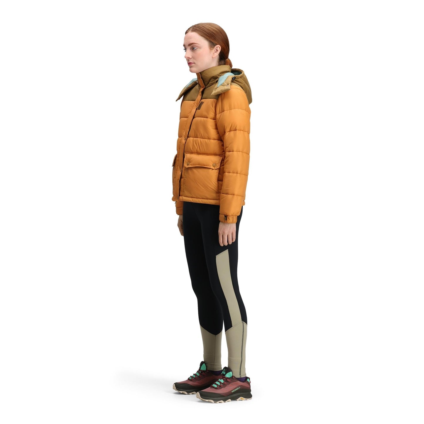 General side model shot of Topo Designs Retro Ridge Puffer Jacket - Women's  in "Dark Khaki / Spice"