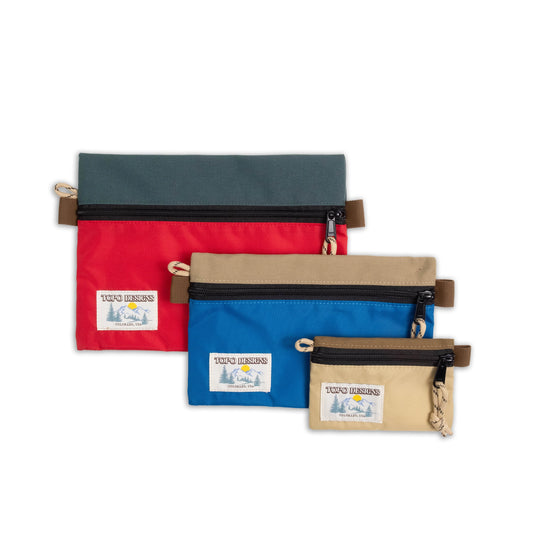 Topo Designs Accessory Bags - product shot of the "Medium", "Small", and "Micro" accessory bags in "Red / Blue Multi"