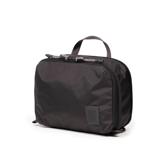 Front View of Topo Designs Global Compression Pack Bag 5L in "Black / Black"