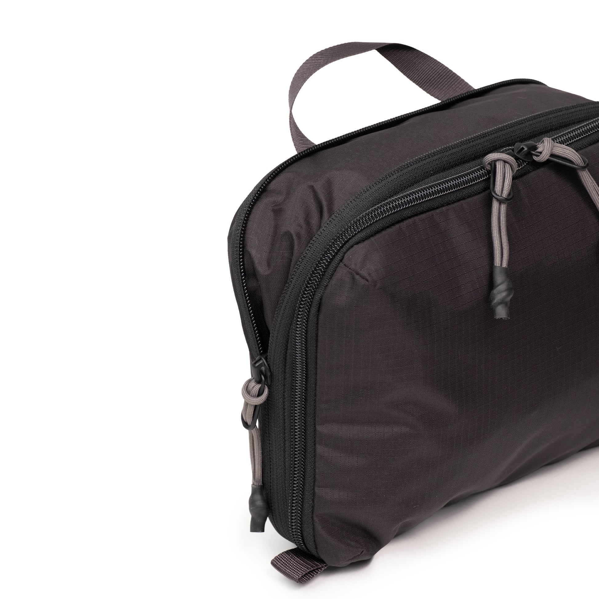 General Detail shot of Topo Designs Global Compression Pack Bag 5L in "Black / Black"