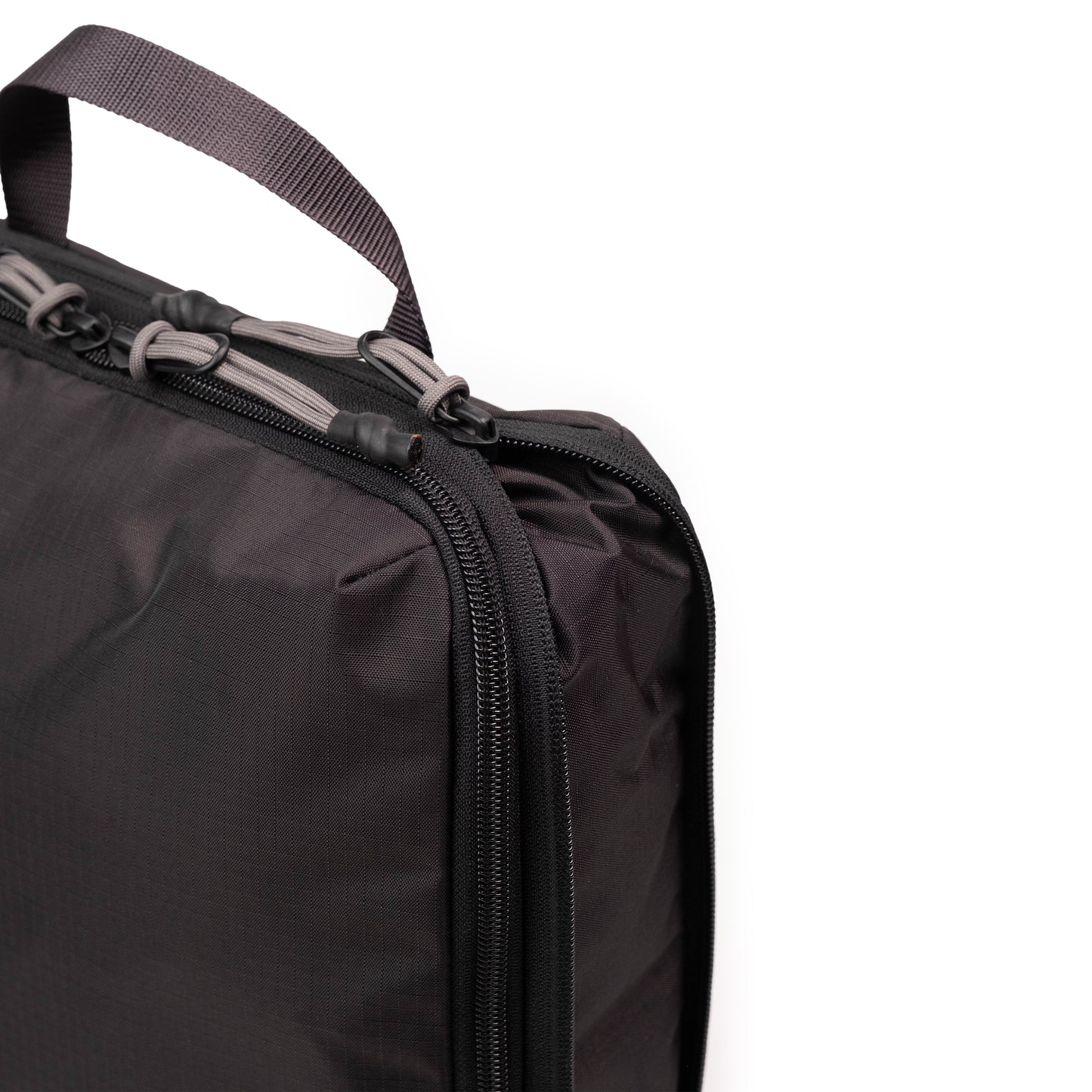 General Detail shot of Topo Designs Global Compression Pack Bag 10L in "Black / Black"